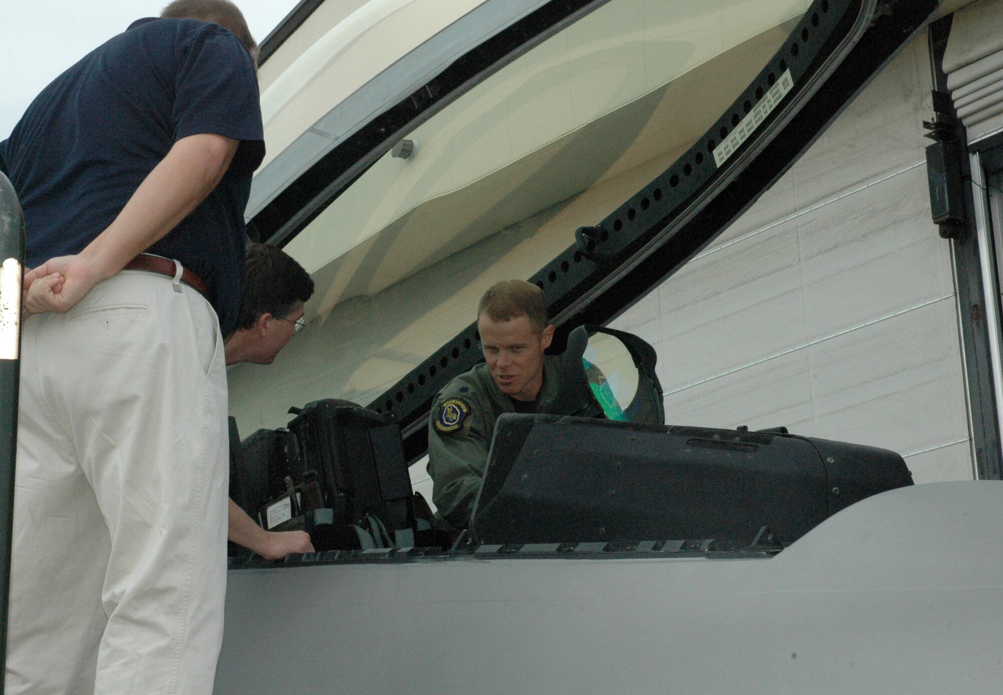 Lt. Col. Derek France, 43rd Fighter Squadron commander, shows members of the Bay County Leadership Bay class the cockpit of a F-22 Raptor here Wednesday.  The Leadership Bay class was on base all day as part of a community relations tour to show the students the different types of missions on Tyndall AFB.  (U.S. Air Force Photo/Staff Sgt. Timothy R. Capling)