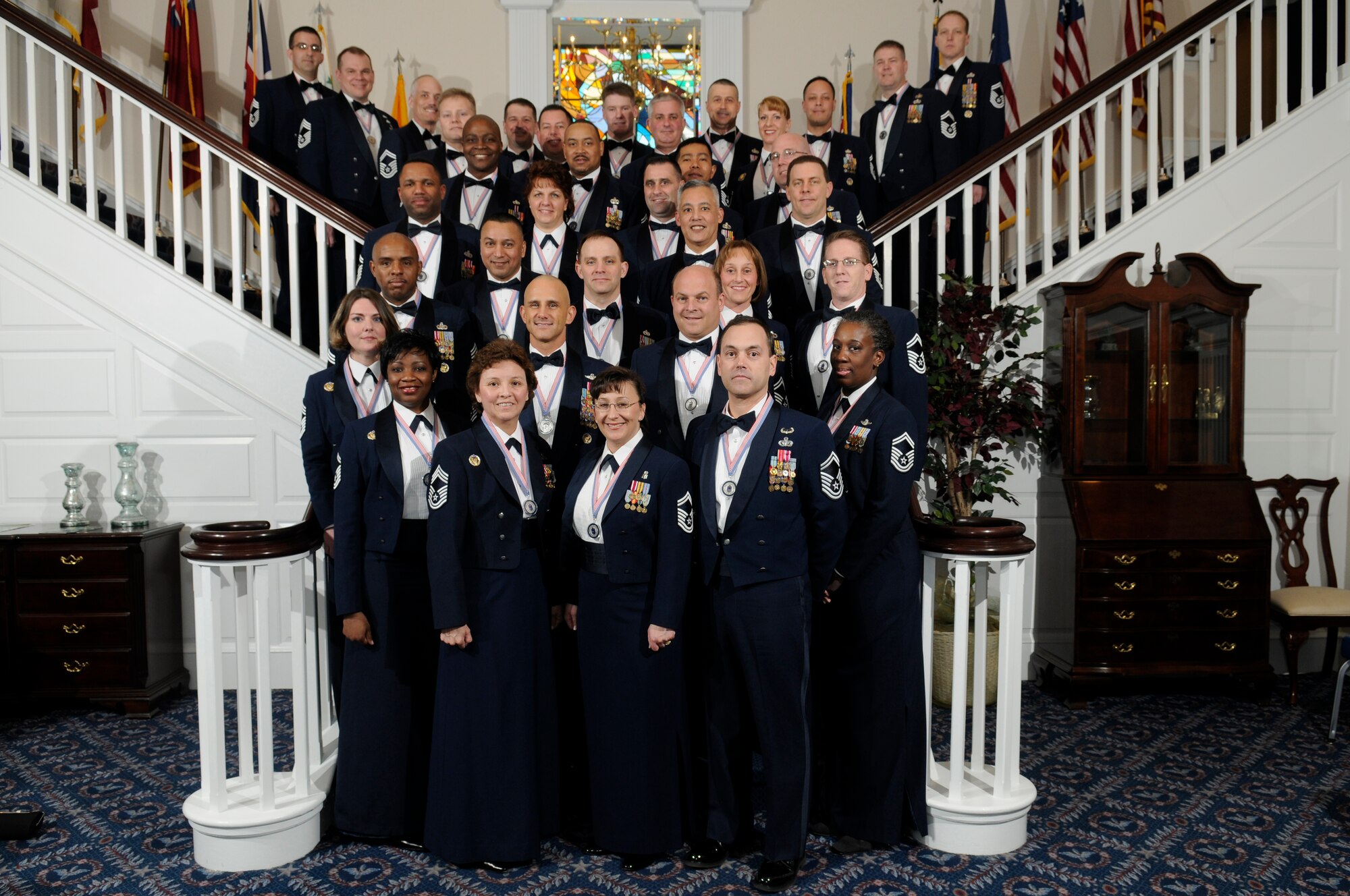 The 35 newest chief master sergeants from the Air Force District of Washington pose for a photo before the Chiefs Recognition ceremony in the Bolling Club Feb. 21. Recognized for their promotions were Angela Abshire, Chris Barnard, Andrew Barth, Kenneth Beyer, Philip Brown III, Rhonda Buening, Glen Coleman, Thomas Cooper, Kelley Downey, Stephen Farrell, Terry Foster, Miranda Garza, Tundra Gatewood, Larry Gruzs, Michelle Hentschel, Franchot Hicks, William Jackson, John Kubik, Stephen Lebrun, Craig LeDoux, George Lytle, Onofre Martin Jr., David McKinney, Michael McQueeny, Ishraph Mohammad, Vicki Robinson, Francisco Rodriguez, Richard Simonsen, John Snow, Bradley Spilinek, Mark Stevenson, Greg Truglio, Bernice Van Dusen, Kurt Wachs, and George Wickizer. (U.S. Air Force photo by Staff Sgt. Dan DeCook)
