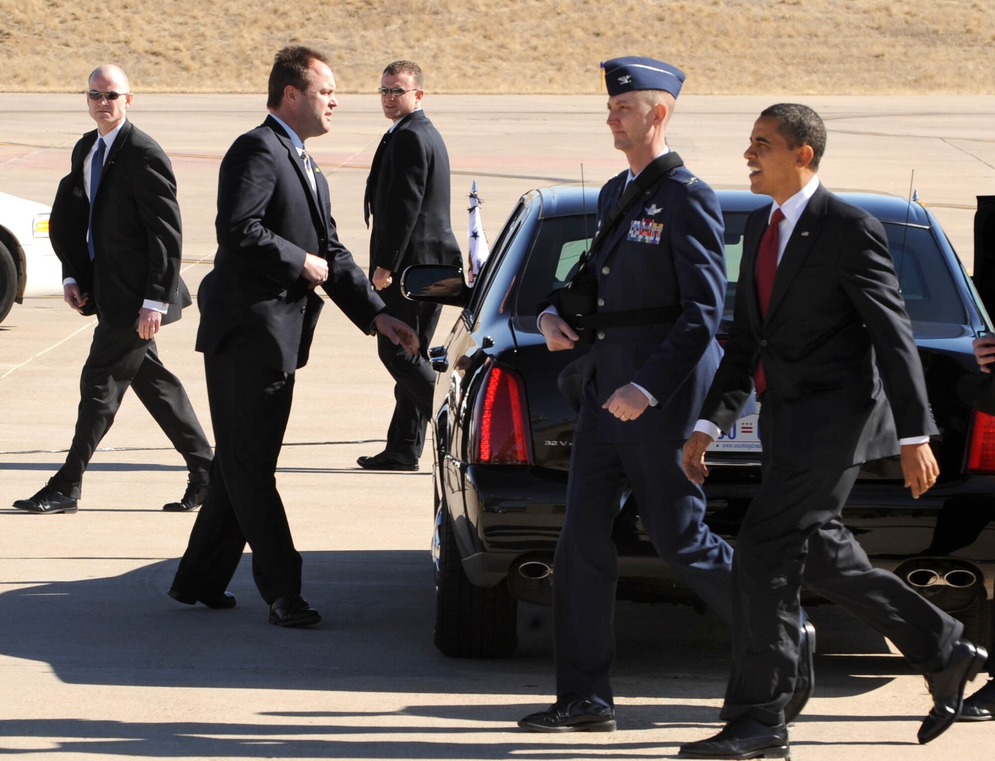 BUCKLEY AIR FORCE BASE, Colo. -- President Barack Obama walks with Col. Wayne McGee, 460th Space Wing Commander, to meet a handful of troops from Team Buckley. President Obama was in Denver to sign into law a new economic stimulus plan designed to create millions of jobs and boost consumer spending. (U.S. Air Force photo by Senior Airman Christopher Bush)