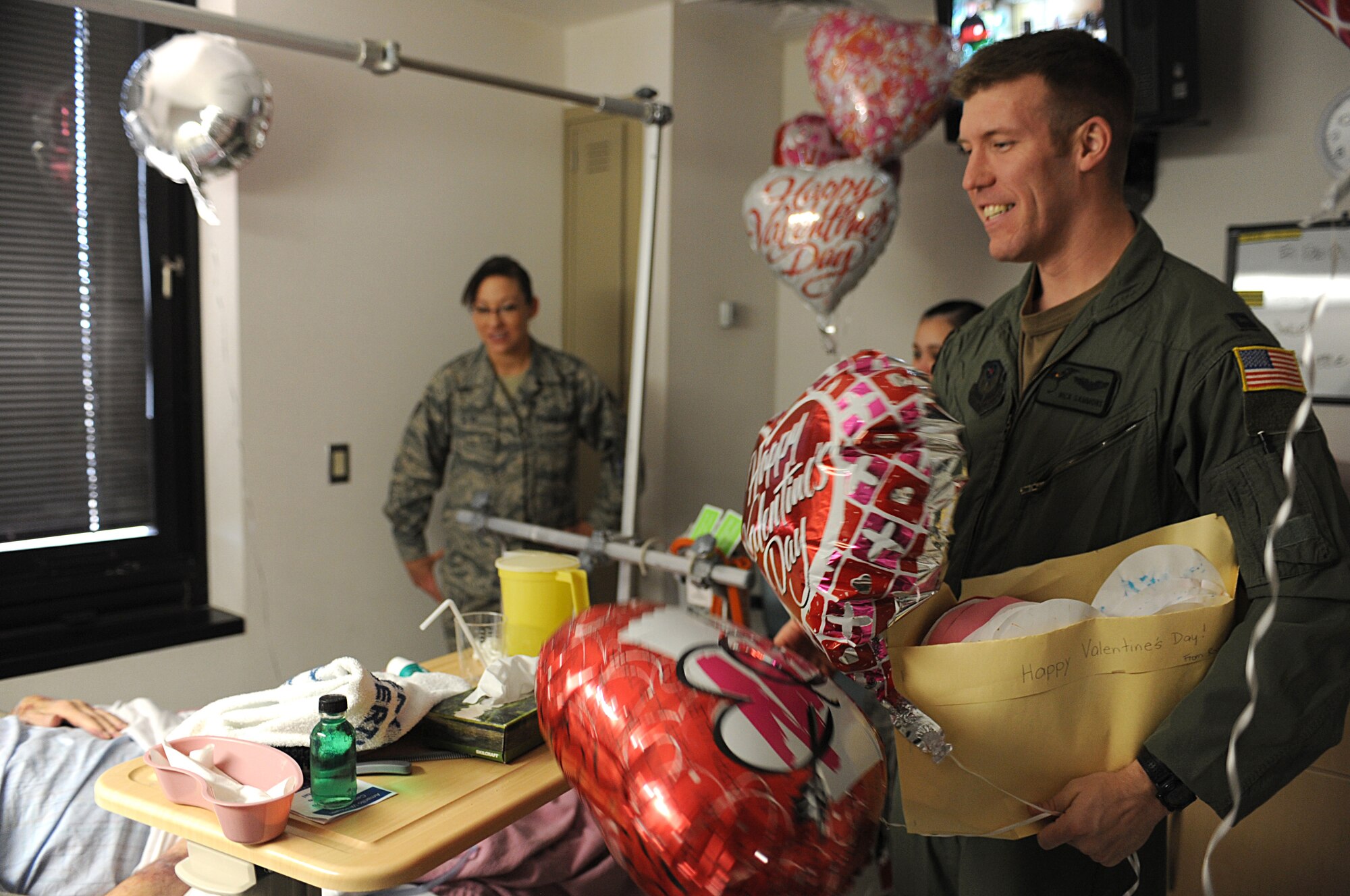 CANNON AIR FORCE BASE, N.M. -- Capt. Nicholas Sammons, 3rd Special Operations Squadron, hands out valentine cards to veterans during the Valentines for Veterans visit Feb. 13. Airmen volunteered their time to visit patients of the Thomas E. Creek Department of Veterans Affairs Medical Center in Amarillo, Texas. (U.S. Air Force photo/Airman 1st Class Evelyn Chavez)