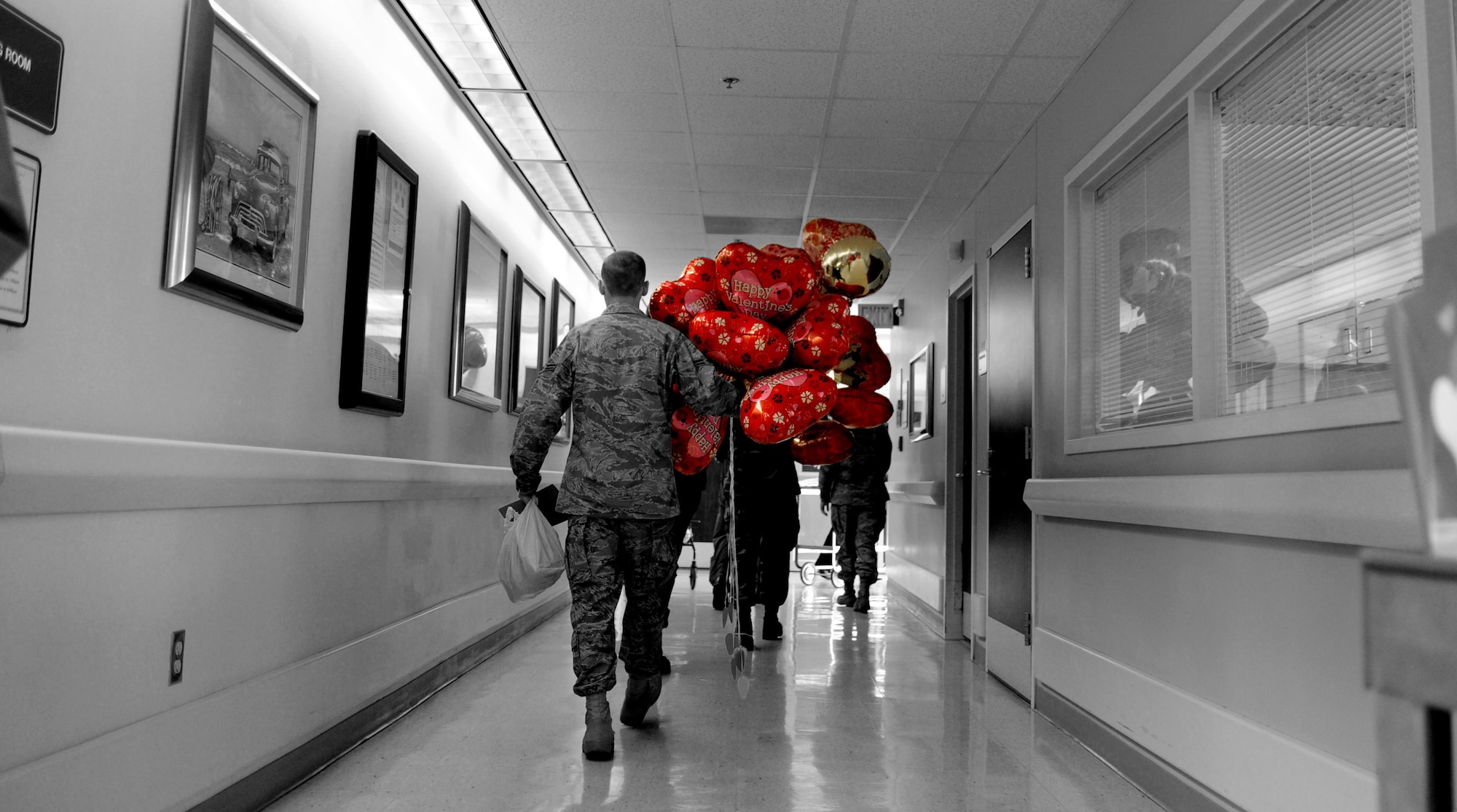 CANNON AIR FORCE BASE, N.M. -- An Airman walks the hallway during the Valentines for Veterans visit Feb. 13. Airmen volunteered their time to visit patients of the Thomas E. Creek Department of Veterans Affairs Medical Center in Amarillo, Texas. (U.S. Air Force photo illustration/Airman 1st Class Evelyn Chavez)