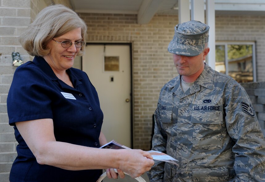 MOODY AIR FORCE BASE, Ga. -- Sara McArthur, South Georgia Greeting Service greeter, welcomes Staff Sgt. Jeremiah Bowes, 74th Aircraft Maintenance Unit crew chief, to Valdosta by providing him with information about the local area Feb. 19. The greeting service, which offers information and coupons for local area businesses, also provides helpful information to make an Airman’s change of station a smooth transition. (U.S. Air Force photo by Senior Airman Gina Chiaverotti)