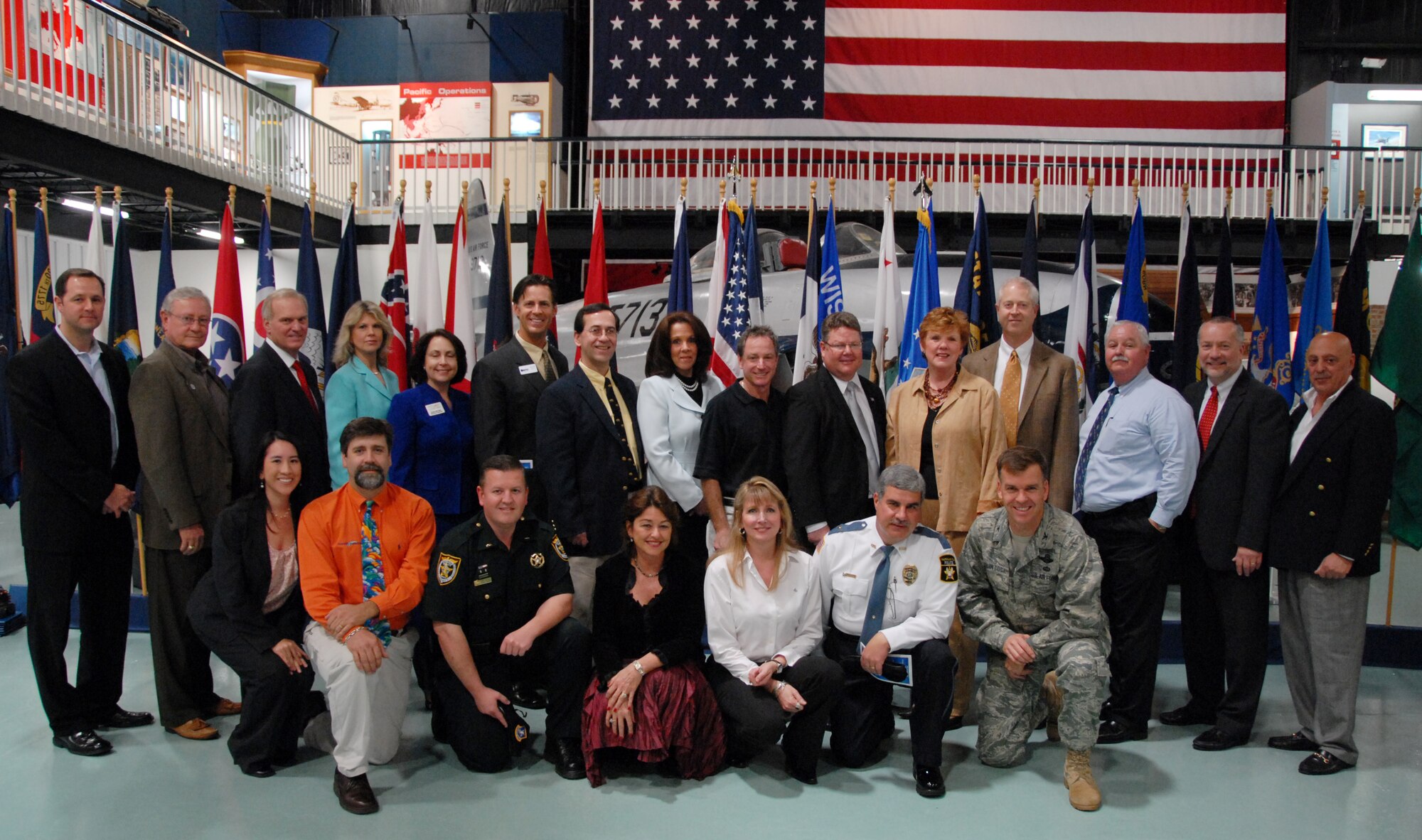 The 2009 96th Air Base Wing honorary commanders were named Feb. 18 during a ceremony at the Air Armament Museum.  The honorary commanders program gives members of the local community a unique opportunity to interact with and learn about Eglin’s Airmen, their mission and the role they play in supporting the Air Force. In turn, honoraries may invite commanders to community functions, building and maintaining positive relationships between the military and local communities.  (Back row, left to right): Justin Hill, Darrel Jones, Ed Coleman, Melinda Stein, Leah McGill, Bart Swan, Dr. Samuel Capra, Susan Shea, Jeff Harris, William Leaman, Cindy Frakes, Steven Essig, Tim Hester, Jim Curry, and Dominik Damiano.(Front row, left to right kneeling): Nancy Stanley, Don Abrams, Robert Maloney (Lieutenant), Dr. Alexis Tibbetts, Michele Nicholson, Joseph Hart (Chief), Col. Bruce McClintock.  Air Force photo/Samuel King Jr. 