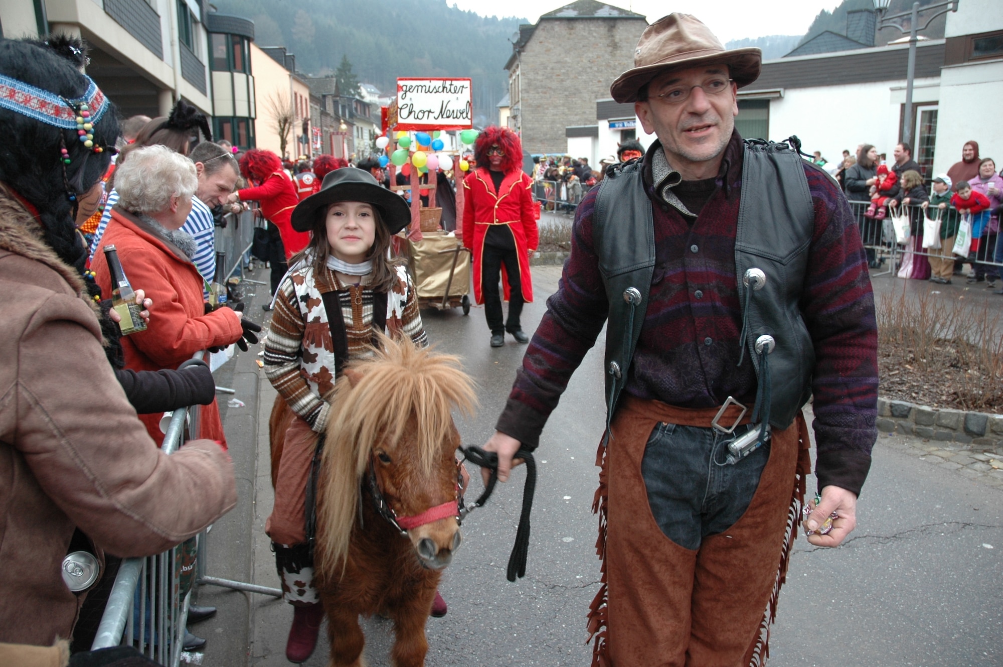 KORDEL, Germany – A cowboy and cowgirl enjoyed a walk passing by the crowd at the Kordel fashing parade Feb. 22, 2009. Parade observers stand in the streets, cheering, singing and dancing. (U.S. Air Force photo by Iris Reiff)