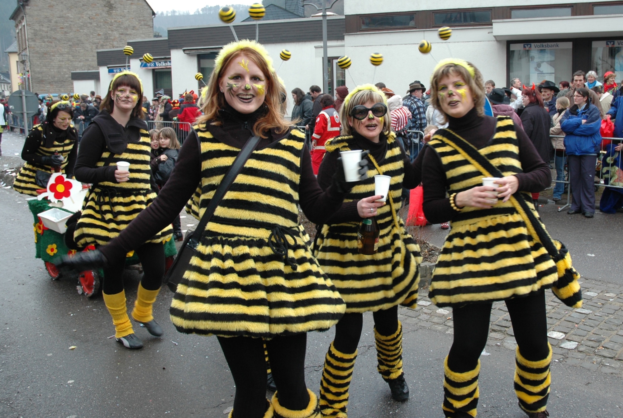 KORDEL, Germany – Women and their children, dressed-up in bee costumes for the Kordel fashing parade, greet onlookers Feb. 22, 2009. The costume was nice and warm, perfect for the cold weather. Almost every village in Germany, regardless of size, conducts a fashing parade. (U.S. Air Force photo by Iris Reiff)