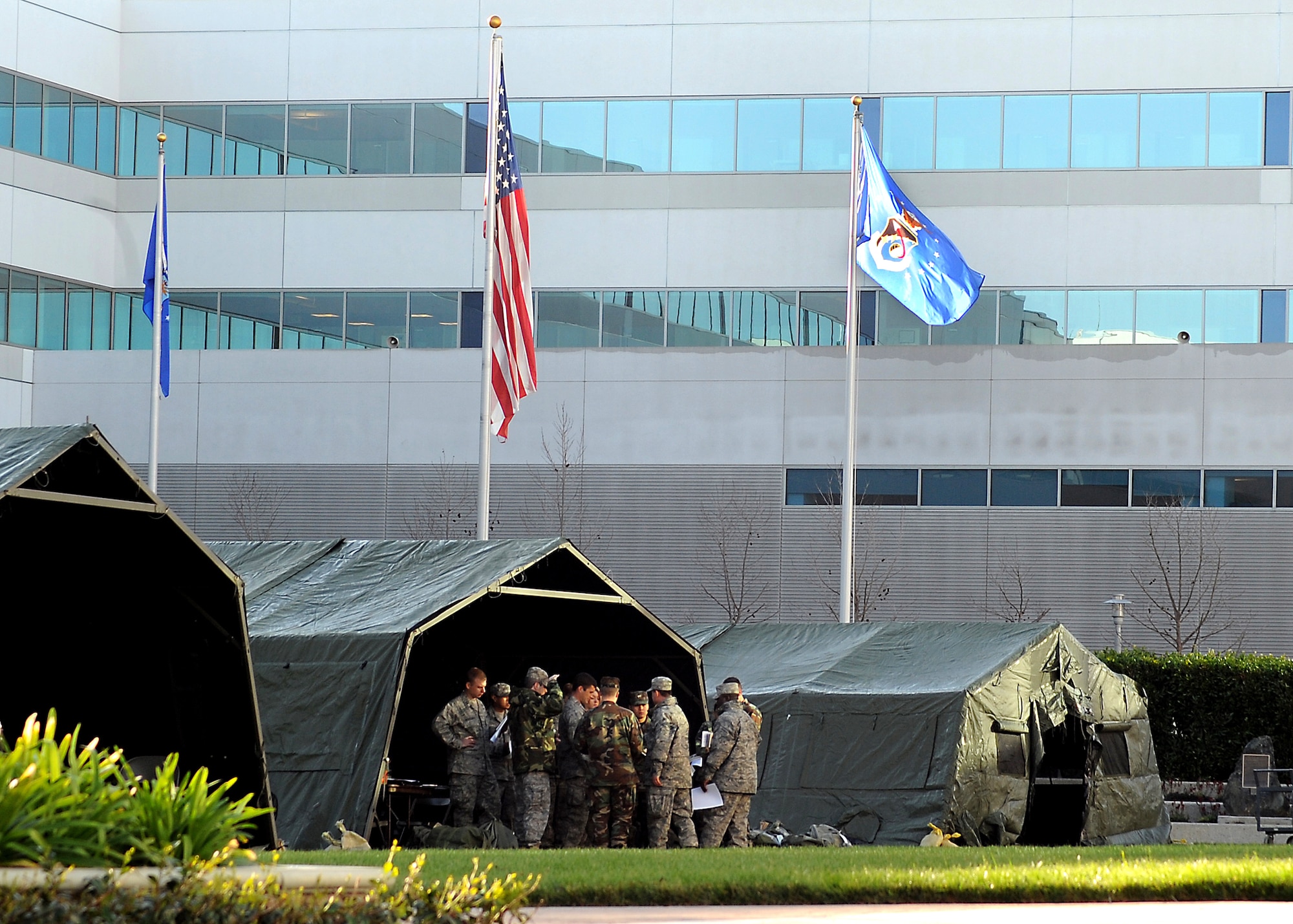 Tents in place, Los Angeles Air Force Base conducts a bi-monthly ATSO (Ability To Survive and Operate) Rodeo amidst the office buildings of the Schriever Space Complex on base in preparation for an upcoming Operation Readiness Evaluation, Feb. 12. Four stations were set up for weapons training, self aid and buddy care training, Post Attack Reconnaissance (PAR), and chemical/biological training, (Photo by Joe Juarez) (RELEASED)