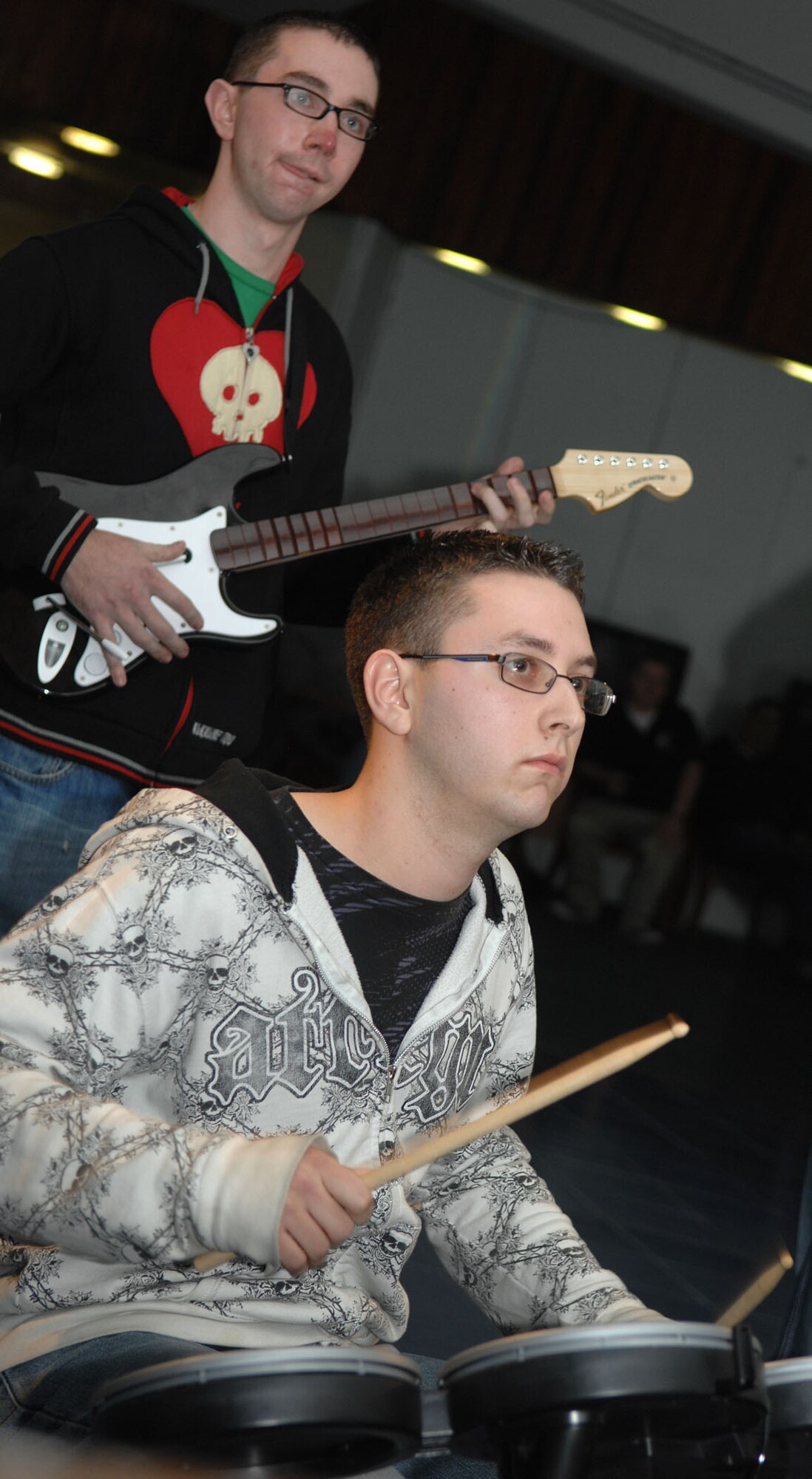 Dan Nelson, drums, and Jerrid Christoff, bass guitar, members of the 1st place band, compete during a "Rockband Jam" tournament at Incirlik’s community center, Feb. 20. United States Air Forces in Europe's program "Project Cheer" sponsored the event by donating $300 for the grand prize. The first place band also included Ken Green, lead guitar and Brian Szarek, vocals. (U.S Air Force photo by Senior Airman Erica Stewart)