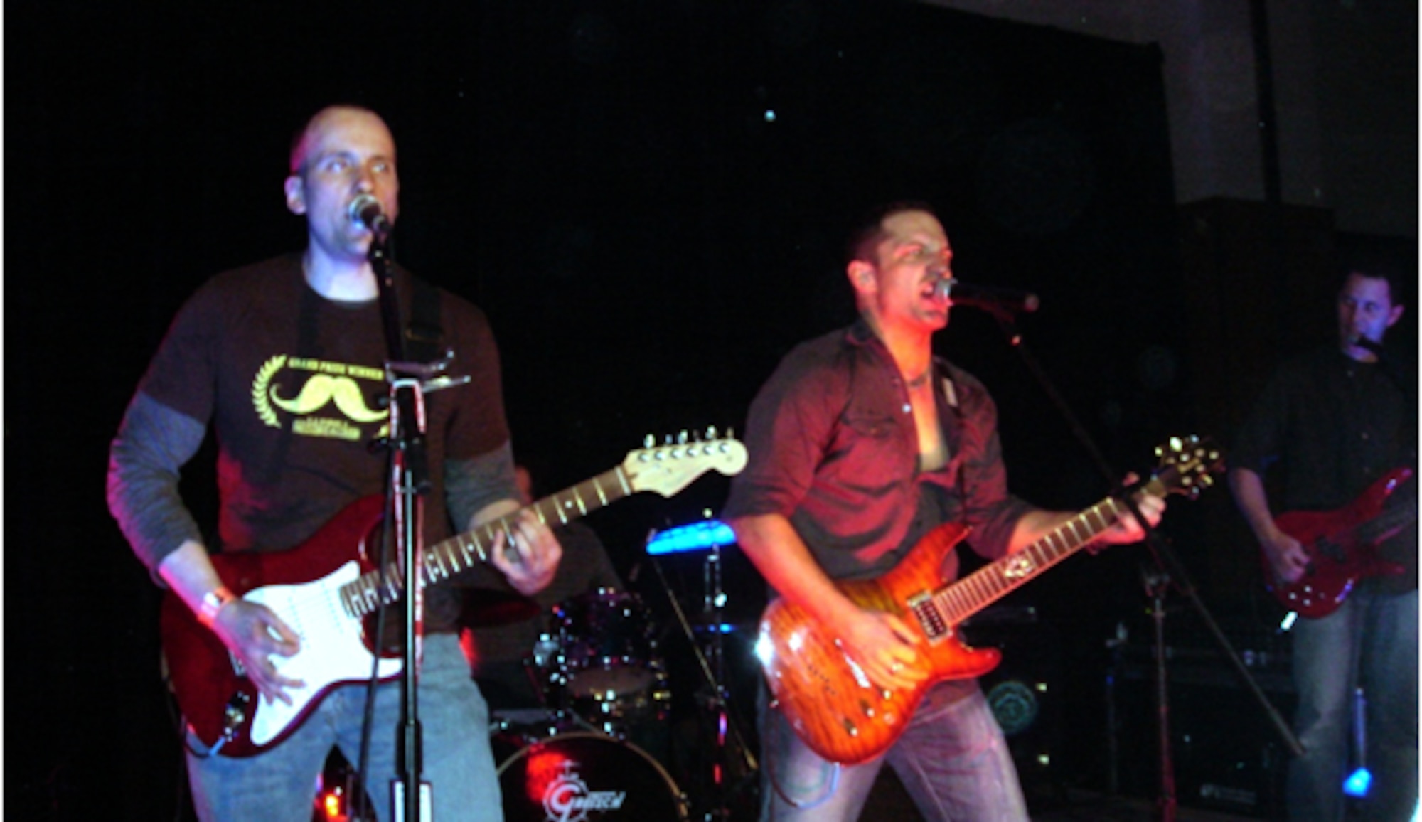 LAS VEGAS – Maj. Robert “Trip” Raymond and his band, “Dos Gringos,” perform on stage at the Hard Rock Café in Las Vegas during a concert to benefit the Air Warrior Courage Foundation Jan. 30, 2009. The 52nd Operations Support Squadron chief of wing weapons and lead guitarist helped raise $3,300 for the foundation that provides support to former prisoners of war and their families. (Courtesy photo)