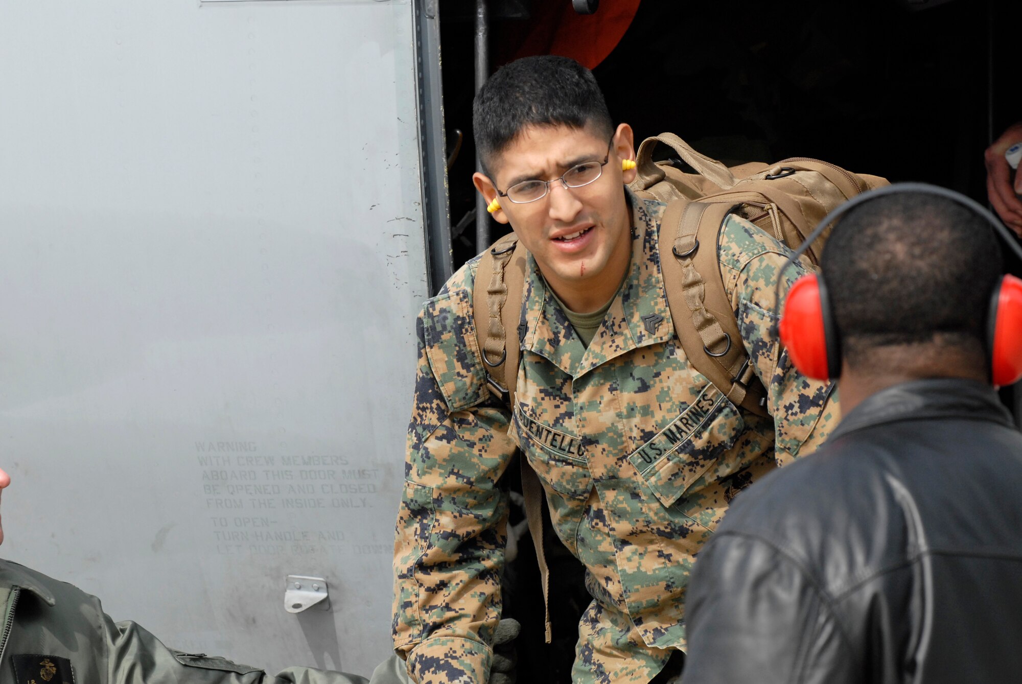 Marine Sgt. Reyes Buentello, Switch Board Operator with the Marine Wing Communcations Squadron 18 from Marine Air Station Futenma, Okinawa, Japan, offloads from a KC-130J Super Hercules, Feb 23, 2009 at Kunsan Air Base, Republic of Korea. The Marines are here in support of the upcoming exercise Key Resolve. (U.S. Air Force Photo by SSgt Jason Colbert)