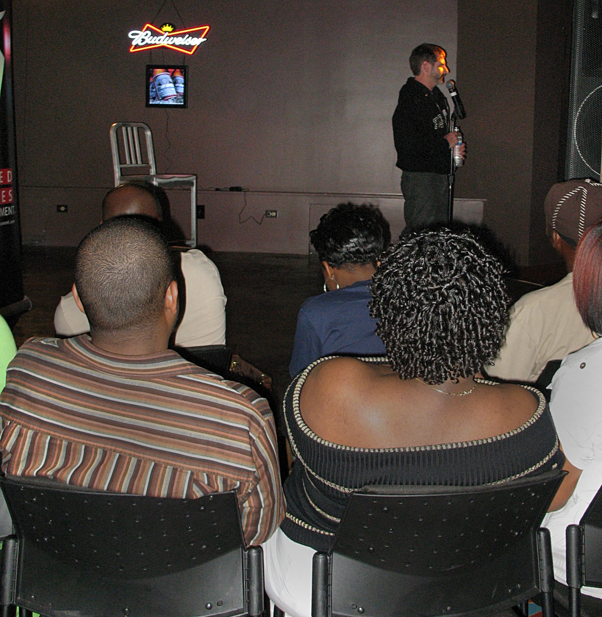 ANDERSEN AIR FORCE BASE, Guam -- Comedian Dan Moore performs his act for a packed house at Top of the Rock Hightides Lounge Feb. 21 here. Mr. Moore was one of four comedians who put on a free show for Andersen. Approximately 150 Team Andersen personnel attended the show. (U.S. Air Force photo by Airman 1st Class Carissa Wolff)