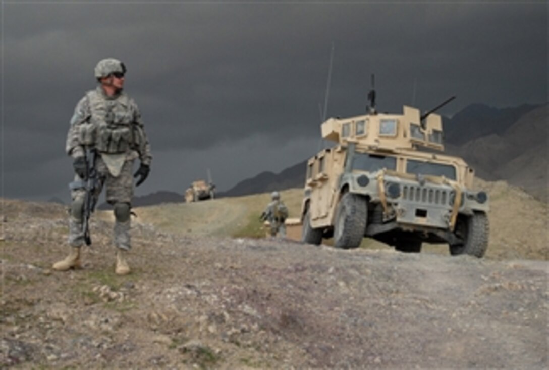 U.S. Army 1st Lt. Larry Baca from Charlie Company, 1st Battalion, 4th Infantry Regiment monitors the weather as a storm moves in outside of Forward Operating Base Lane, Afghanistan, on Feb. 19, 2009.  