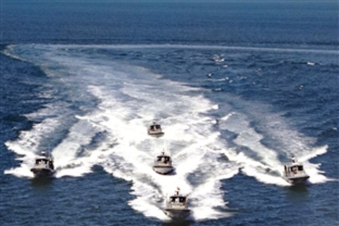 Several 34-foot Dauntless Sea Arks from U.S. Navy Maritime Expeditionary Security Squadron 3 patrol San Diego Bay in a training exercise, Feb. 19, 2009, to prepare for upcoming deployments to Southwest Asia and Rota, Spain.