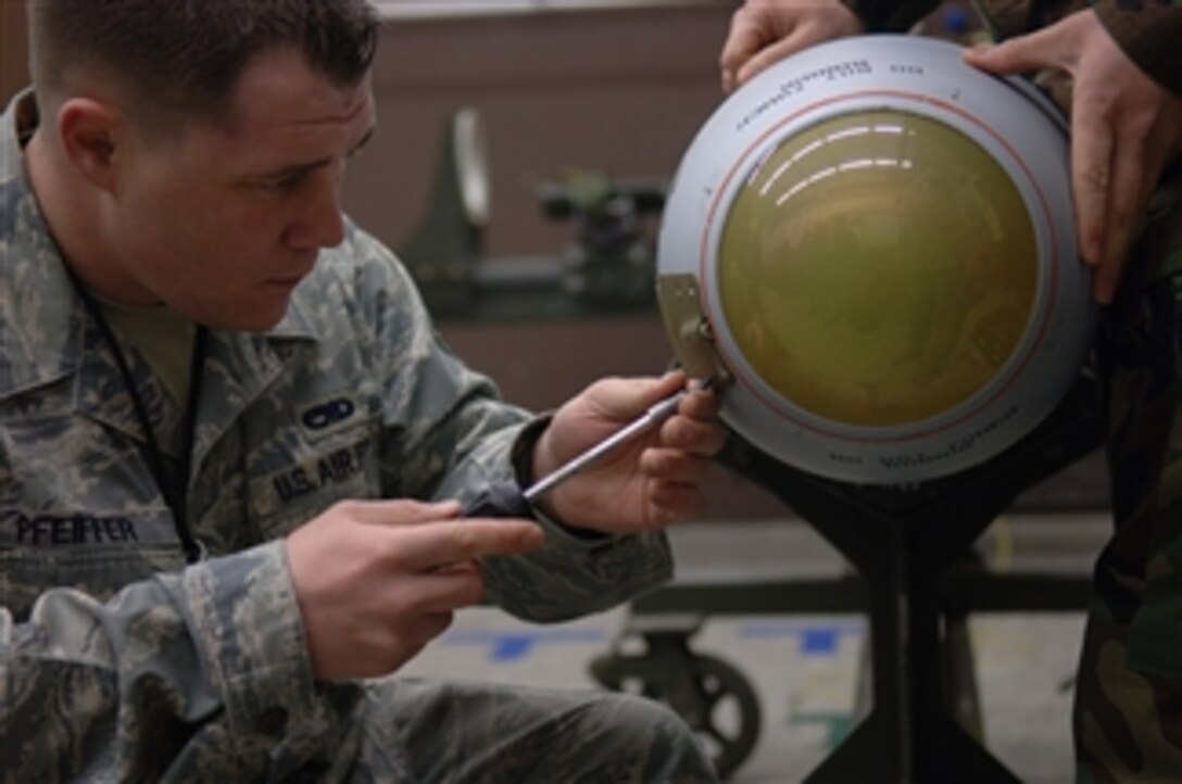 U.S. Air Force Staff Sgt. Timothy Pfeiffer of the 435th Munitions Squadron removes a panel from an AGM-65 Maverick missile during a test at Ramstein Air Base, Germany, on Feb. 4, 2009.  