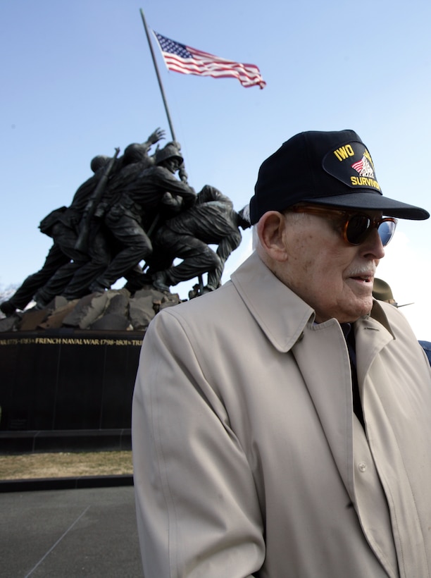 Retired Marine Maj. Norman Hatch stands in front of the Marine Corps War Memorial in Arlington, Va., just after a flag raising ceremony Feb. 23.  The ceremony was held to honor those who fought and raised the American flag atop Mount Suribachi in Iwo Jima, Japan, Feb. 23, 1945, during World War II.  Retired Marines, active duty Marines, reserve Marines and civilian spectators came to the memorial to observe the 64th anniversary of the infamous day in the nation’s history.