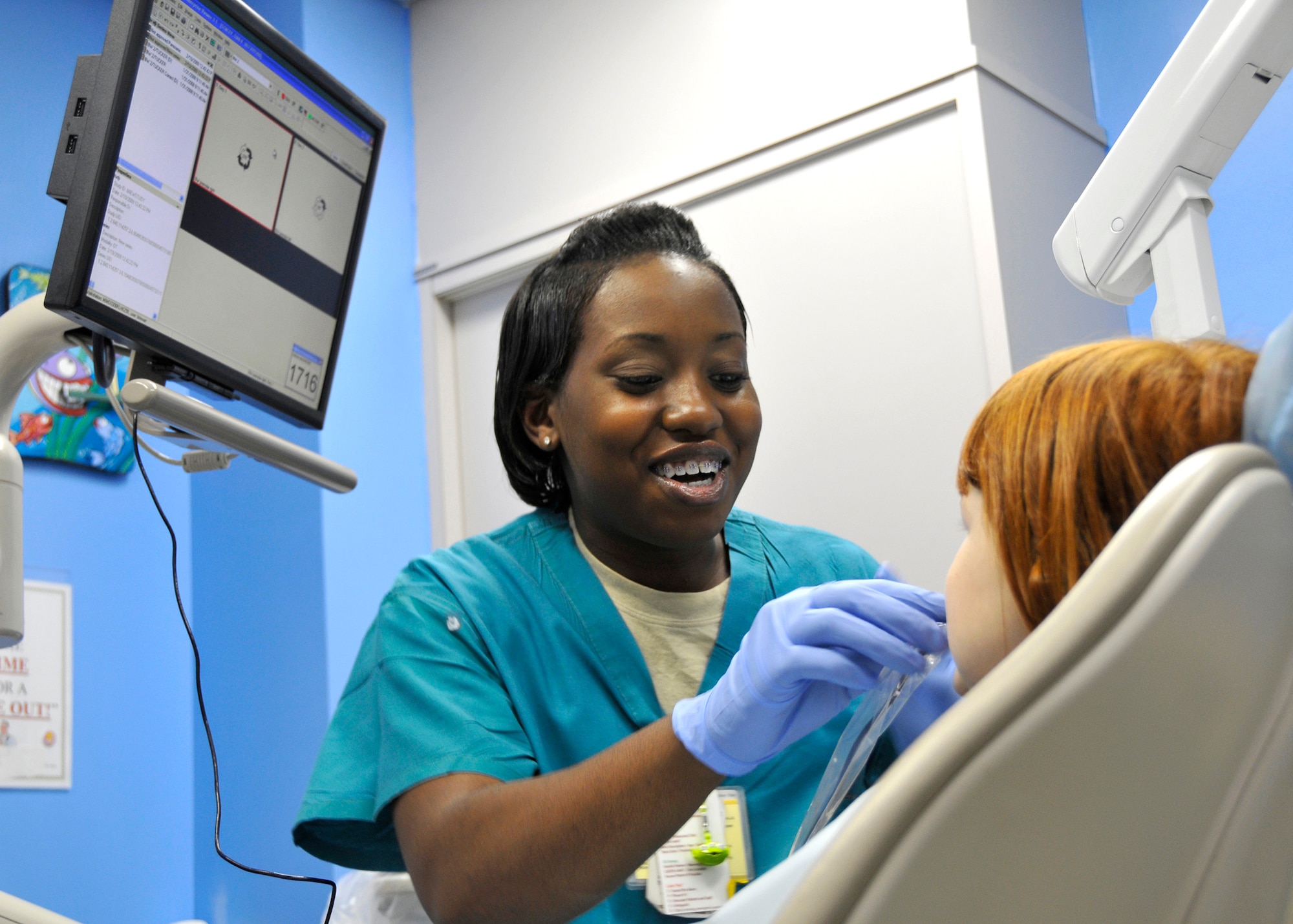 MISAWA AIR BASE, Japan -- Senior Airman Lottie Stewart, 35th Dental Squadron pediatric dentistry technician, prepares a patient for an X-ray Feb. 19, 2009. Airman Stewart joined the Air Force in November 2005 and is the 2008 Air Force Outstanding Dental Airman of the year. (U.S. Air Force photo by Senior Airman Chad Strohmeyer)
