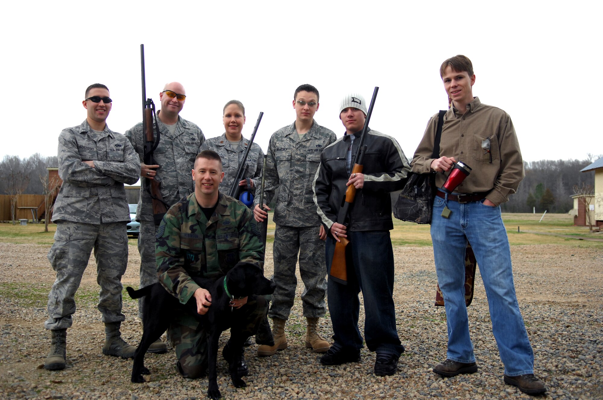 A group of Airmen from Barksdale spent the morning of Feb. 21 at the Red Chute Shotgun Sports Club  alongside members of ESPN and their distinguished visitors. Afterwards, the visitors braved the puring rain for a tour of a B-52 provided by the 917th Wing.(U.S. Air Force photo by 2d. Lt Amy Abbott)