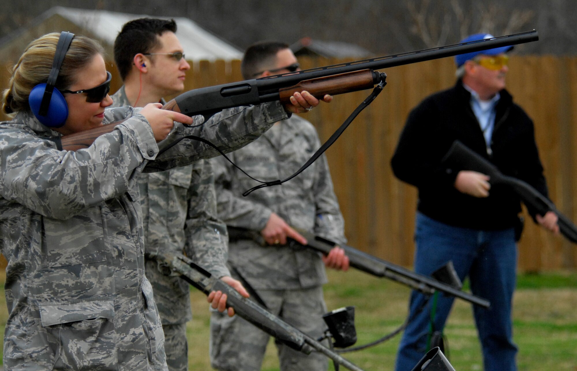 Maj. Melissa Simmons, 2d Medical Group optometrist, shots clay targets on Feb 21. The group of Airmen joined members of ESPN and their distinguished visitors for a morning at the Red Chute Shotgun Sports Club on base.  (U.S. Air Force photo by 2d. Lt Amy Abbott)