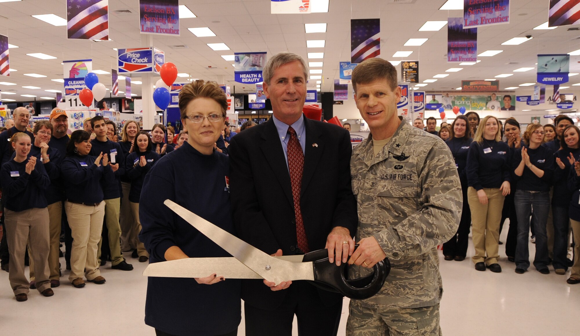AAFES General Manager Mrs. Anna VanHolveln, Mr. Mike Howard AAFES Chief Operating Officer and 354th Fighter Wing Commander Brig. Gen. Mark Graper cut the ribbon to the new Base Exchange Feb. 20, 2009, Eielson Air Force Base, Alaska. Eielson is a test base for a central BX, Shoppette, and a Car Care Center. (U.S. Air Force photo/Airman 1st Class Laura Max) 