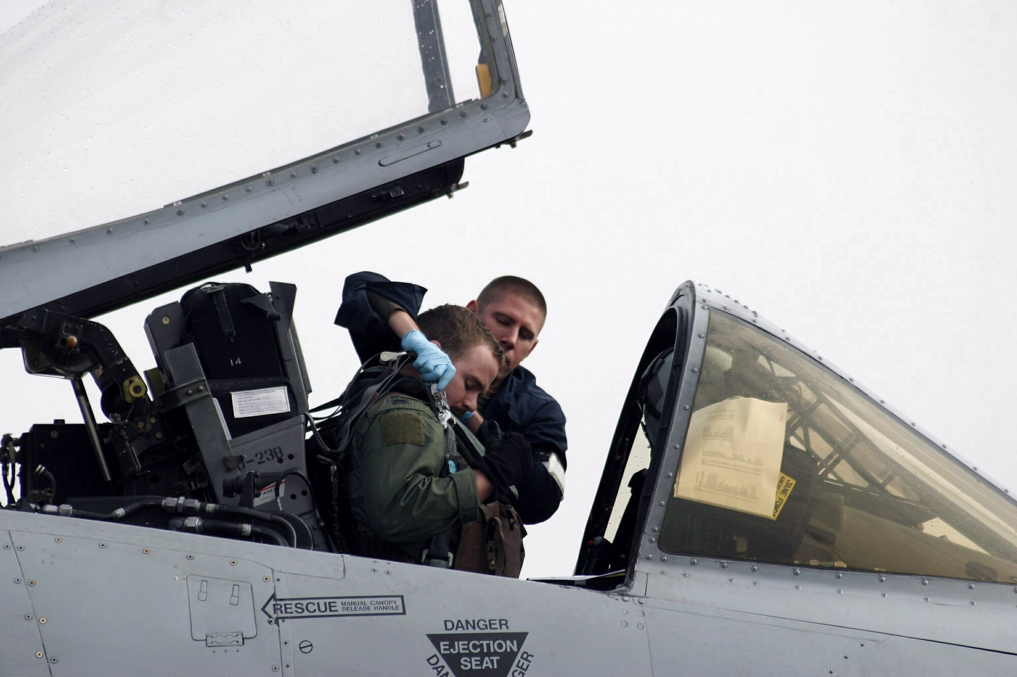 An A-10 Thunderbolt II pilot prepares for a close-air-support mission with the assistance of a ground crewmember during Green Flag East 09-04 Feb. 23 at Barksdale Air Force Base, La. (U.S. Air Force photo/Casey Bain)