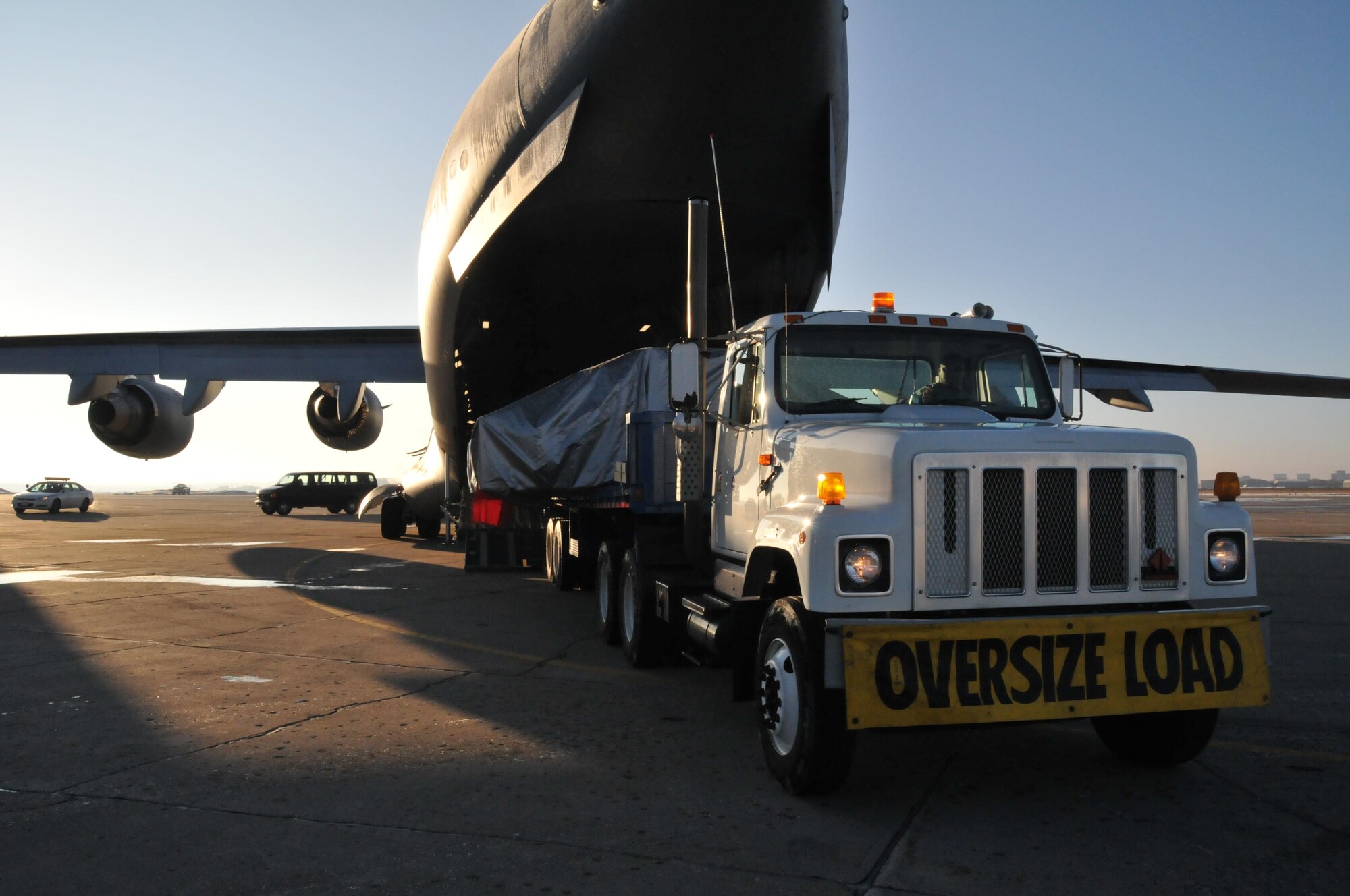 A section of the Express Logistics Carrier for the International Space Station is loaded aboard a C-17 from Dover Air Force Base, Del. Feb. 8 for transport into space on the Space Shuttle.  The carrier is manufactured in Big Lake Minn. and allows long term storage of items for future use at the space station.(Air Force Photo/Master Sgt. Paul Zadach) 