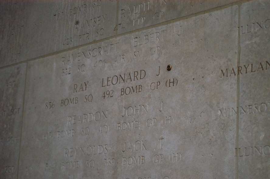 A rosette now appears next to Tech. Sgt. Leonard Ray's name at the Henri-Chapelle Cemetery and Memorial in Belgium, signifying he is no longer missing in action. The rosette was placed during a ceremony held Feb. 20, 2009. Sergeant Ray was a member of the Maryland National Guard whose plane was shot down during World War II. (U.S. Army Photo by Mr. Thaddeus
Moyseowicz)
