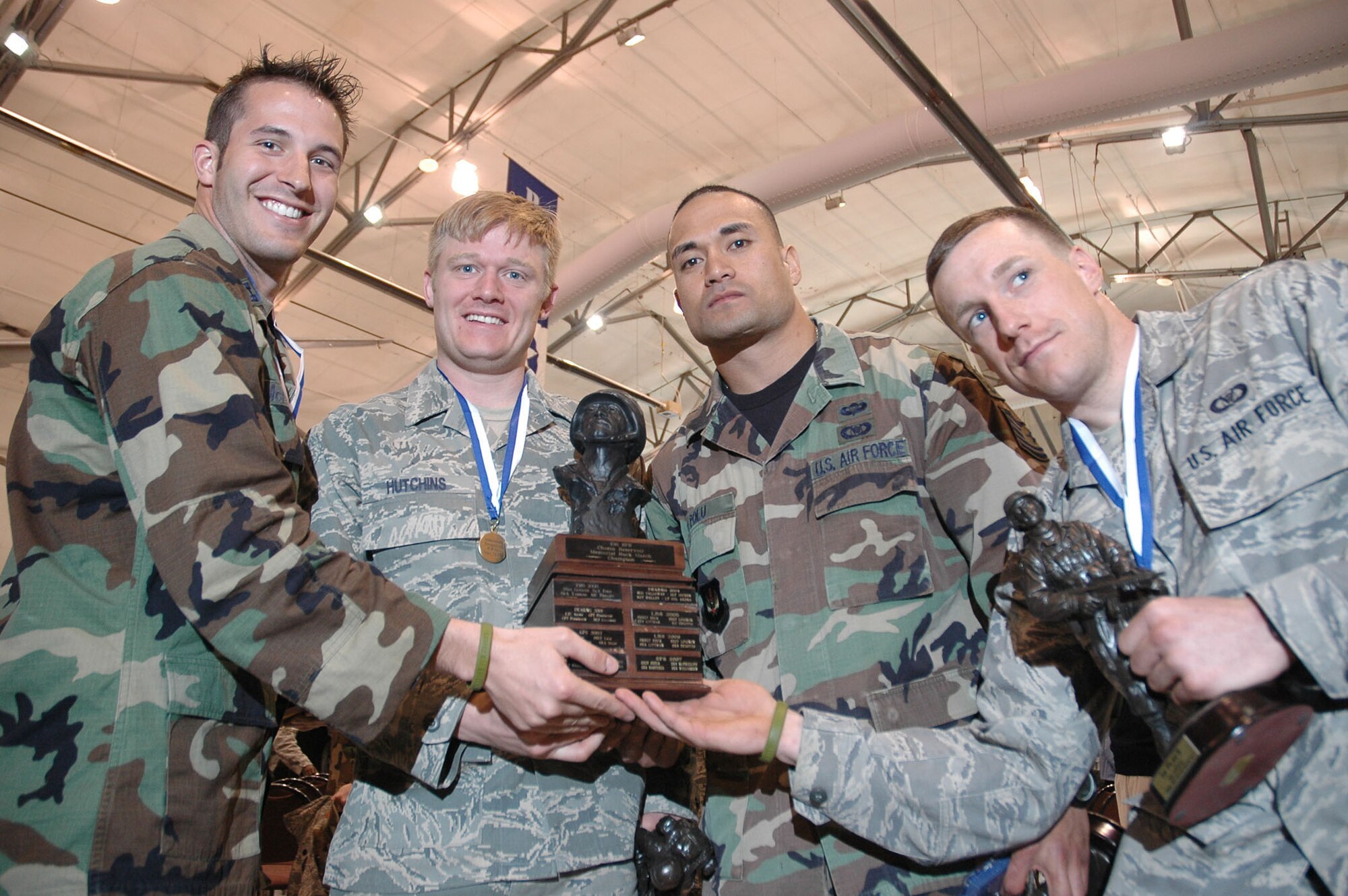 A 14th Air Support Operations Squadron Tactical Air Control Party team from Pope Air Force Base, N.C., took first place at the Dover Air Force Base 10th Annual Ruck March Feb. 21. Team members Capt. Steve McNamara, Airman Benjamin Hutchins, Tech. Sgt. Mitchell Polu, and Airman 1st Class James Demars finished the march in 55 minutes, 29 seconds. The event is sponsored annually by the 436th Security Forces Squadron. Each member of the four-person team must complete the 6.2-mile course while carrying a 30-pound sack on their back. (U.S. Air Force photo/Senior Airman Andria J. Allmond)