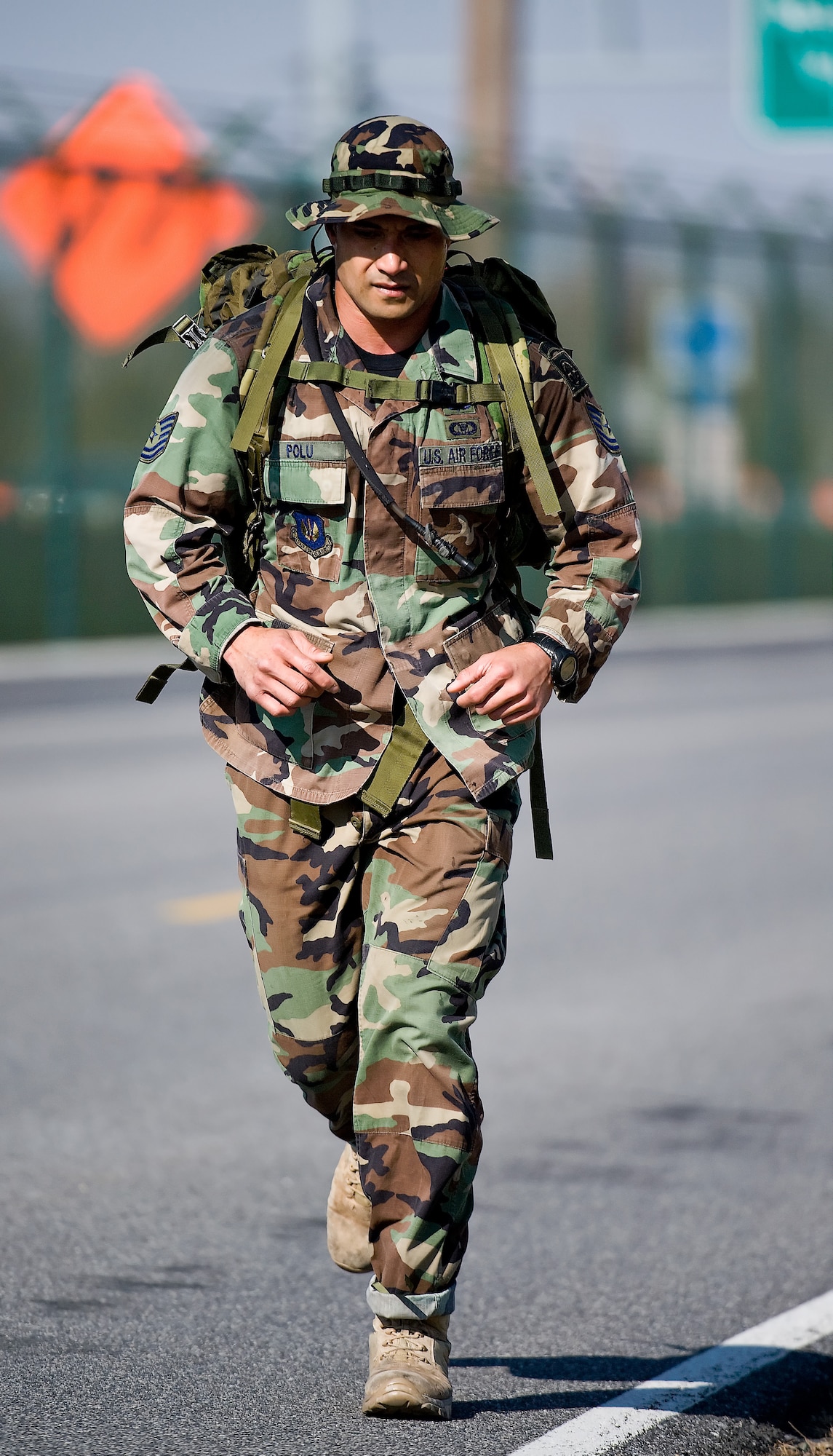 Tech. Sgt. Mitchell Polu, with the 14th Air Support Operations Squadron Tactical Air Control Party team from Pope Air Force Base, N.C., runs in the Dover Air Force Base 10th Annual Ruck March Feb. 21. Sergeant Polu and his team members Capt. Steve McNamara, Airman Benjamin Hutchins and Airman 1st Class James Demars finished the competition in 55 minutes, 29 seconds. The event is sponsored annually by the 436th Security Forces Squadron to honor Korean War veterans who fought in the Battle of the Chosin Reservoir. Each member of the four-person team must complete the 6.2-mile course while carrying a 30-pound sack on their back. (U.S. Air Force photo/Roland Balik)