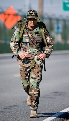 Tech. Sgt. Mitchell Polu, with the 14th Air Support Operations Squadron Tactical Air Control Party team from Pope Air Force Base, N.C., runs in the Dover Air Force Base 10th Annual Ruck March Feb. 21. (U.S. Air Force photo/Roland Balik)