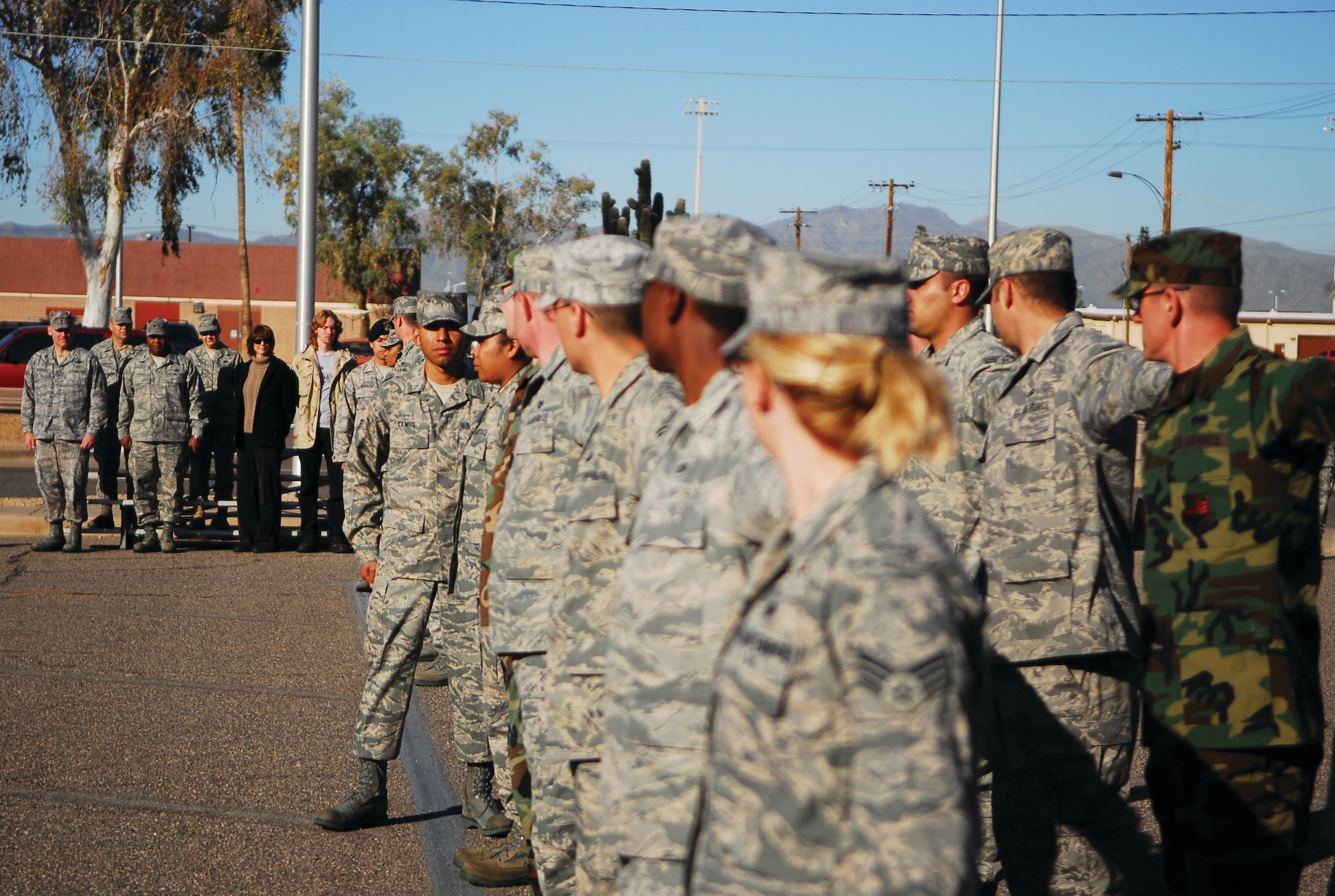 John J. Rhodes Airman Leadership School Class 09-3 Airmen execute dress-right-dress to align a formation before a retreat ceremony Feb. 12. (U.S. Air Force photo/2nd Lt. Bryan Bouchard) 