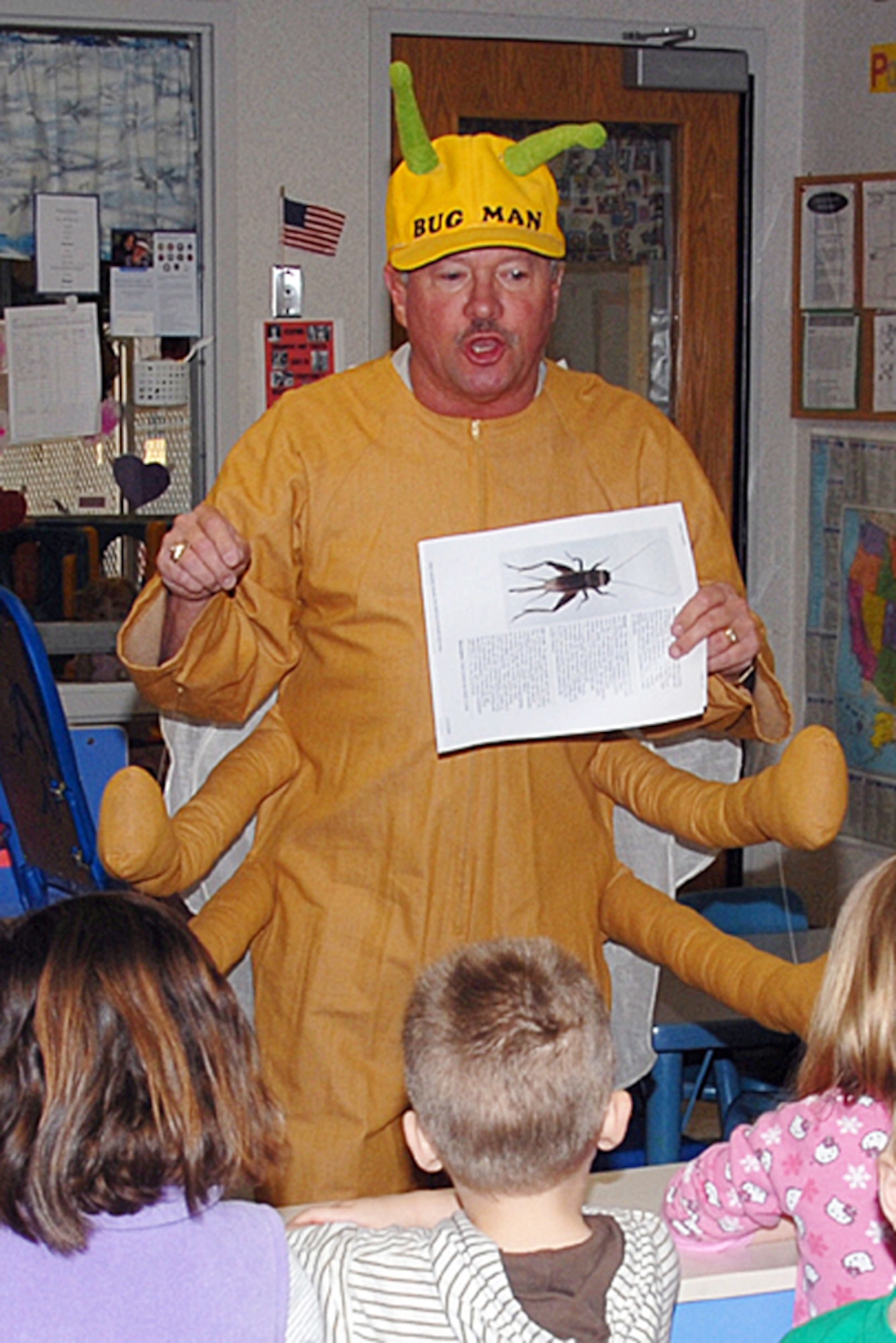 Richard Johndrow, in his “Tommy the Termite” outfit, teaches children in Vance’s Child Development Center about crickets during a Feb. 19 visit. Mr. Johndrow works in the CSC Entomology division. The children are studying a section on crickets and Tommy the Termite asked if they had seen his cousin, “Carl the Cricket.” He explained how crickets live and how soon the children will begin seeing the bugs. (U.S. Air Force photo by Angie Roche)
