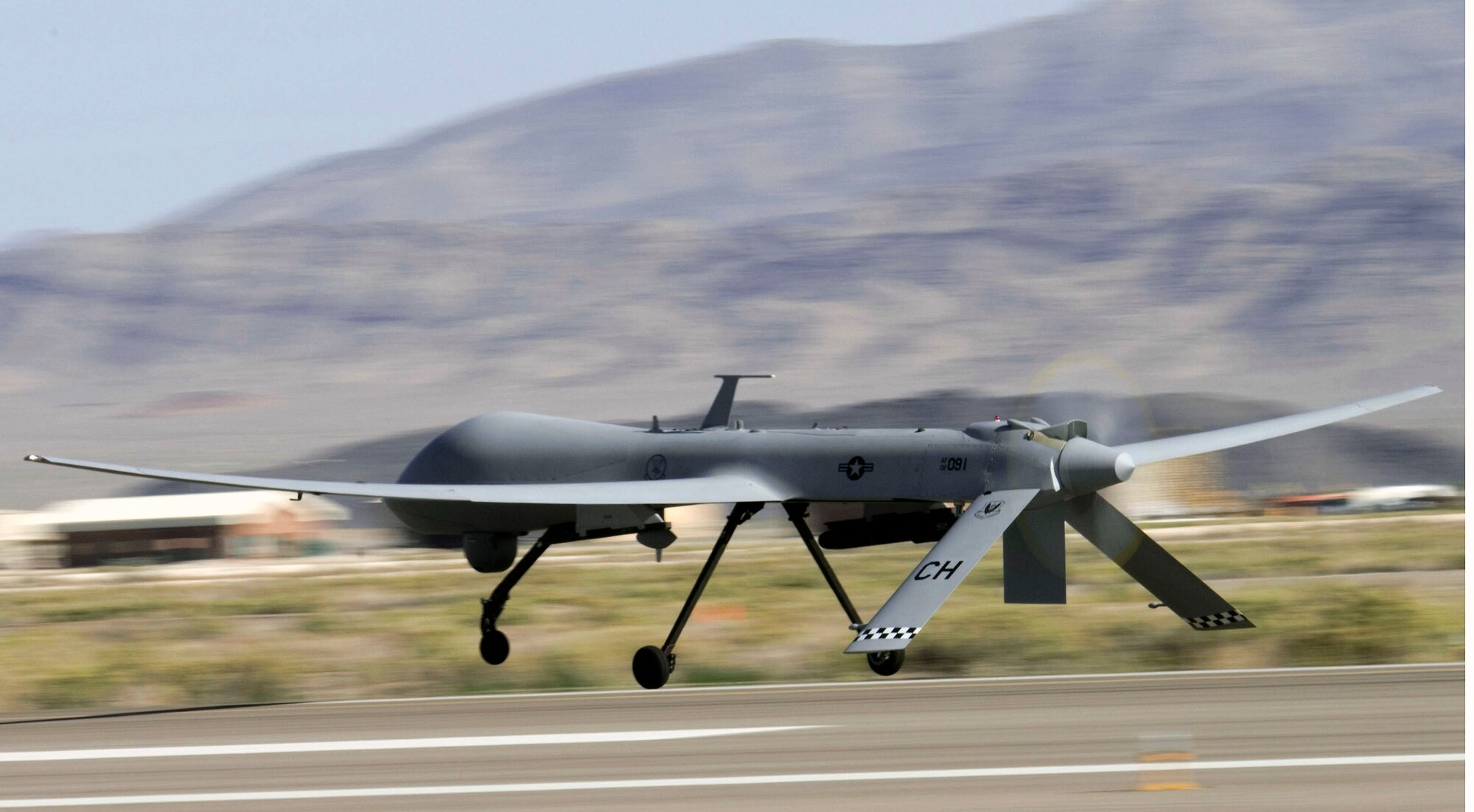 An MQ-1 Predator unmanned aircraft takes off for a training mission at Creech Air Force Base, Nev. (U.S. Air Force photo/Senior Airman Larry E. Reid Jr.) 

