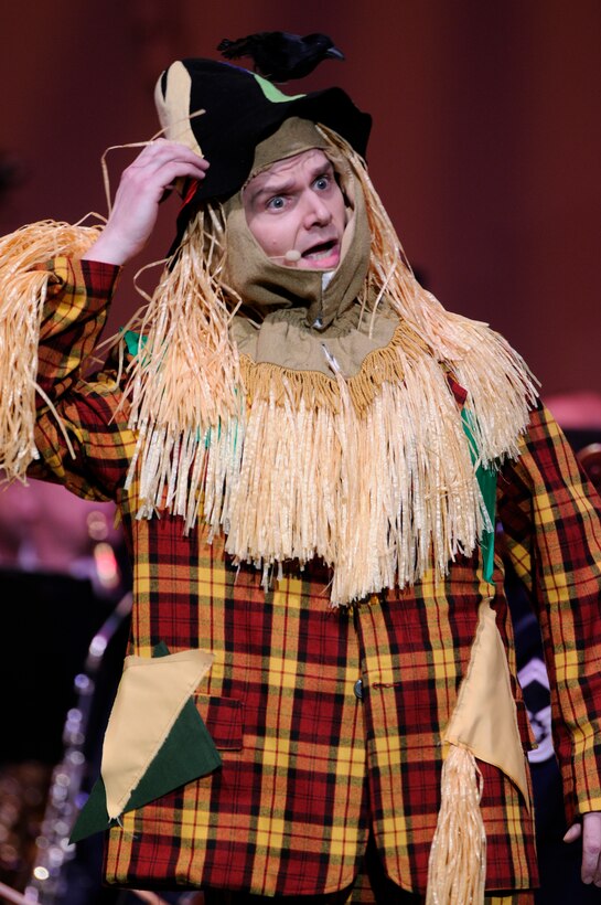 Master Sgt. Robert S. Harrelson, United States Air Force Band Singing Sergeants, performs as the scare crow from the “Wizard of Oz” during this year’s first Guest Artist Series concert at Daughters of the American Revolution Constitution Hall Feb. 22. Charley Pride, legendary Country Music Hall of Fame star, was the guest artist along with guest emcee Bernie Lucas, host of America’s Music on 98.7 WMZQ. (U.S. Air Force photo by Staff Sgt. Dan DeCook)