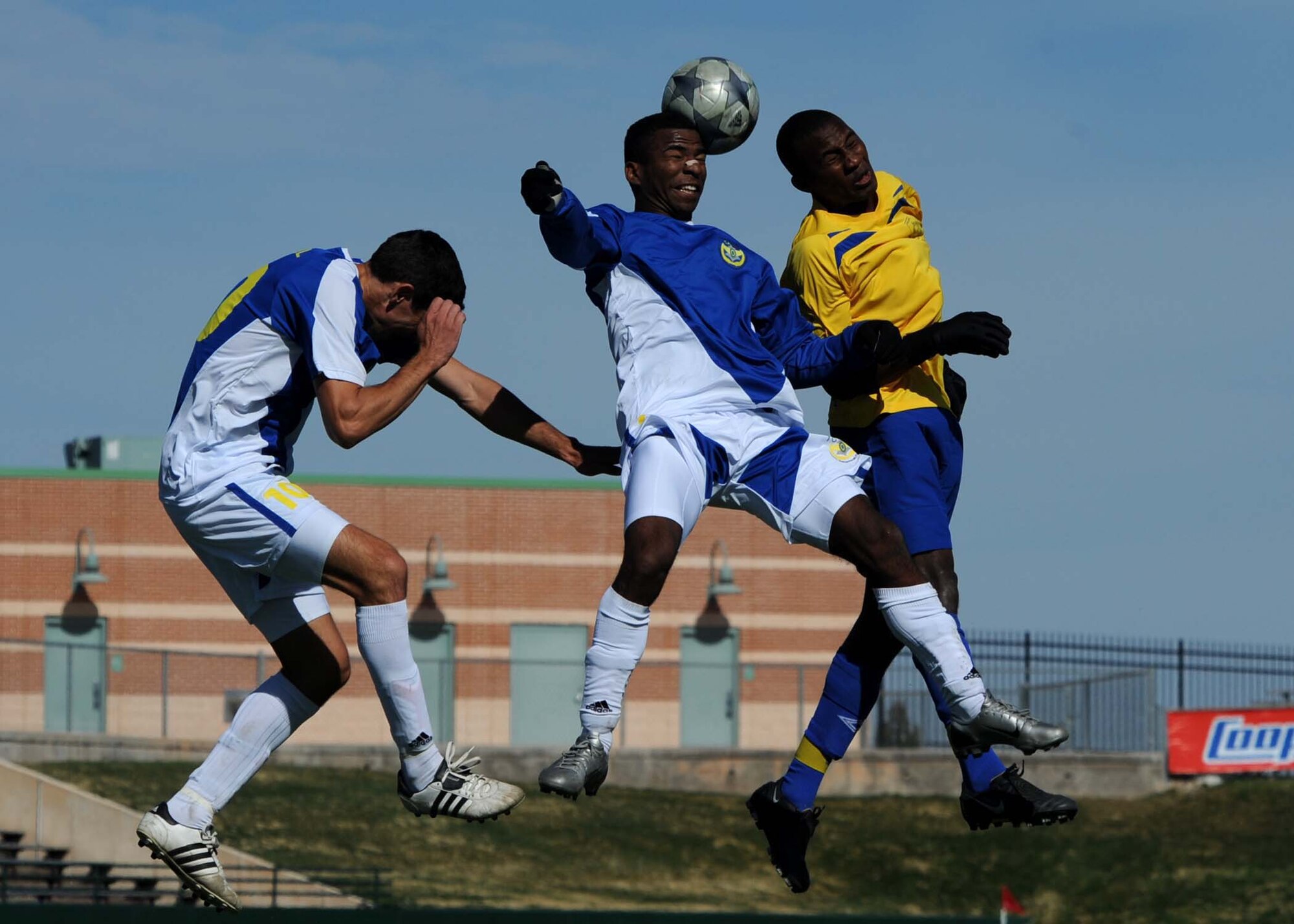 ABILENE, Texas - Barbados (yellow) competes in the third day of the CISM tournament against Brazil at Shotwell Stadium here, Feb. 23. Brazil defeated Barbados 5-1. Also in action Feb. 23, the United States and Suriname tied 4-4. (U.S. Air Force photo by Airman 1st Class Stephen Reyes) 
