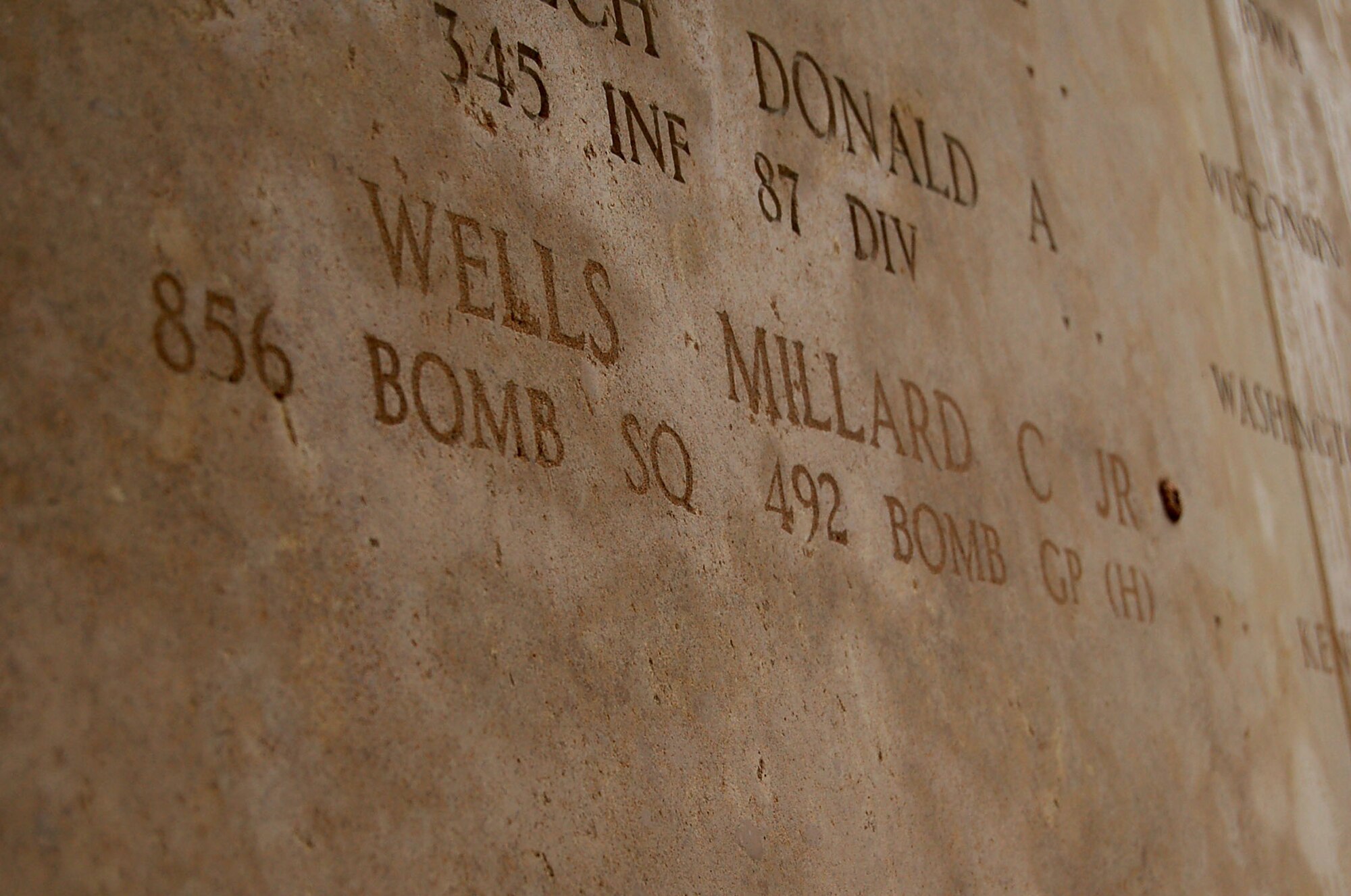 HENRI-CHAPELLE, Belgium -- The rosette next to 2nd Lt. Millard C. Wells’ engraved name signifies he is no longer missing in action. Lieutenant Wells was part of the McMurray Crew, which flew the B-24 bomber during World War II. The remains of the crew and parts of their aircraft were discovered in a field southwest of Berlin in 2002. (U.S. Air Force photo by 2nd Lt. Kathleen Polesnak)