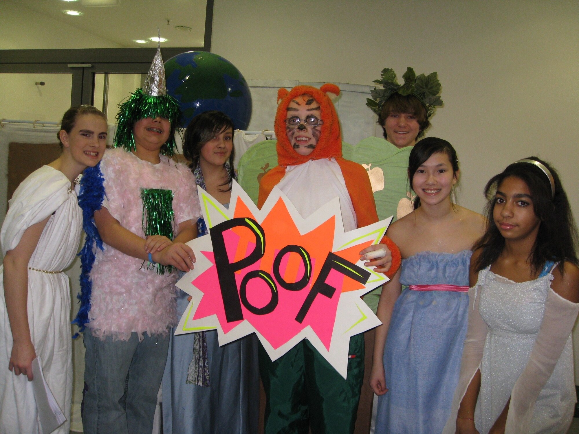 LANDSTUHL, Germany – (Left to right) Liz Buccholz, TJ Trottier, Elena Rodriguez, Paul Naisbitt, Nate Sax, Averi Goetz and Natasha Harris take a moment to commemorate their participation in the 2008-2009 Odyssey of the Mind competition before performing Feb. 21, 2009. The youths are all students at Spangdahlem Middle School. (U.S. Air Force photo by April Goetz)