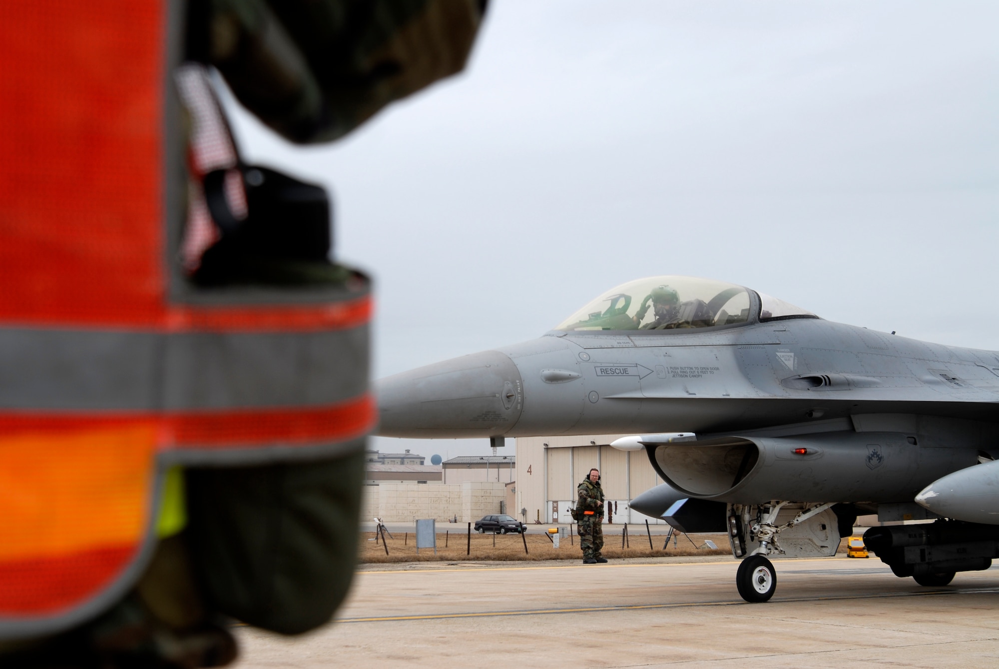 Captain Andre Senay, an F-16 pilot with the 35th Fighter Squadron, salutes Staff Sgt Rodolfo Cortez, 8th Aircraft Maintenance Squadron, prior to take-off at Kunsan Air Base, Republic of Korea, Feb 24, 2009. Kunsan's F-16 Fighting Falcons are flying multiple sorties a day while participating in the Operational Readiness Exercise Beverly Midnight 09-01 (U.S. Air Force Photo by SSgt Jason Colbert)