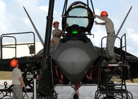 (L-R) Staff Sgt. Terry Vickery, Staff Sgt. Tim Sullivan, and Senior Airman Ryan Ott, 
install an F-22 Raptor canopy using an east-west hoist Feb. 18 at Andersen Air Force Base, Guam. The Raptors are deployed from Elmendorf Air Force Base, Alaska, to Guam , for three months as the Pacific's Theater Security Package. The stealth-fighters, along with associated maintenance and support personnel, comprise the 90th Fighter Squadron and will participate in various exercises that provide routine training in an environment different from their home station. All are F-22 Egress and Systems specialists, deployed from Elmendorf and assigned to the 36th Expeditionary Maintenance Squadron.


(U.S. Air Force photo/ Master Sgt. Kevin J. Gruenwald) released


