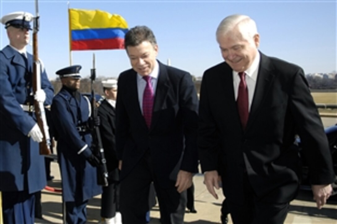 Defense Secretary Robert M. Gates, right, escorts Colombian Defense Minister Juan Manuel Santos through an honor cordon into the Pentagon where the two will discuss bilateral defense issues over a working lunch, Feb. 24, 2009.