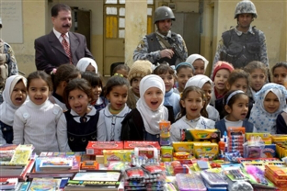 Iraqi school girls sing in Arabic to thank the Iraqi and U.S. forces for their gifts of school supplies to the Al Kays and Al Yasameen elementary school in Oubaidy, Iraq, Feb. 19, 2009. 