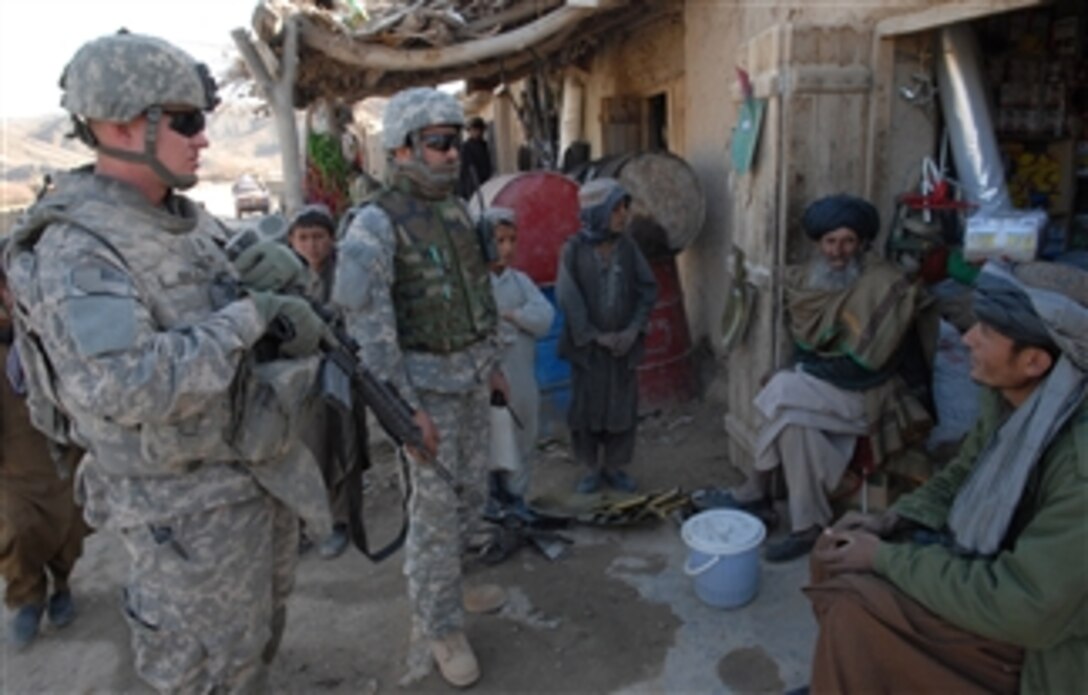 U.S. Army 1st Lt. Larry Baca (left) from Charlie Company, 1st Battalion, 4th Infantry Regiment meets with shop owners in a town near Forward Operating Base Lane, Afghanistan, on Feb. 17, 2009.  