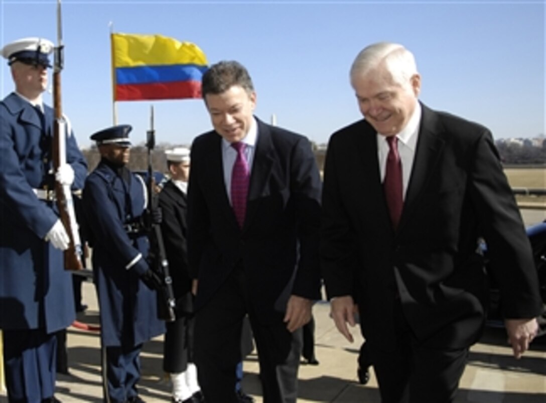 Secretary of Defense Robert M. Gates (right) escorts Colombian Minister of Defense Juan Manuel Santos through an honor cordon and into the Pentagon for a working luncheon to discuss bilateral defense issues on Feb. 24, 2009.  