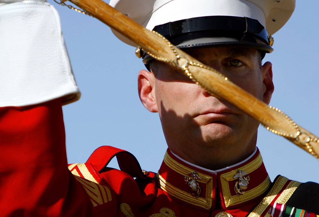 Master Gunnery Sgt. Mark Miller, drum major for the U.S. Marine Corps' Drum and Bugle Corps, uses a ceremonial mace to signal commands to musicians during a performance Feb. 24, 2009, at the Marine Corps Air Station in Yuma, Ariz. The performance marked the beginning of the band's annual tour. For approximately the last 20 years, the Drum and Bugle Corps' has trained annually in Yuma before beginning touring. Miller, the 20th drum major of "The Commandant's Own," is a native of Salisbury, Md.
