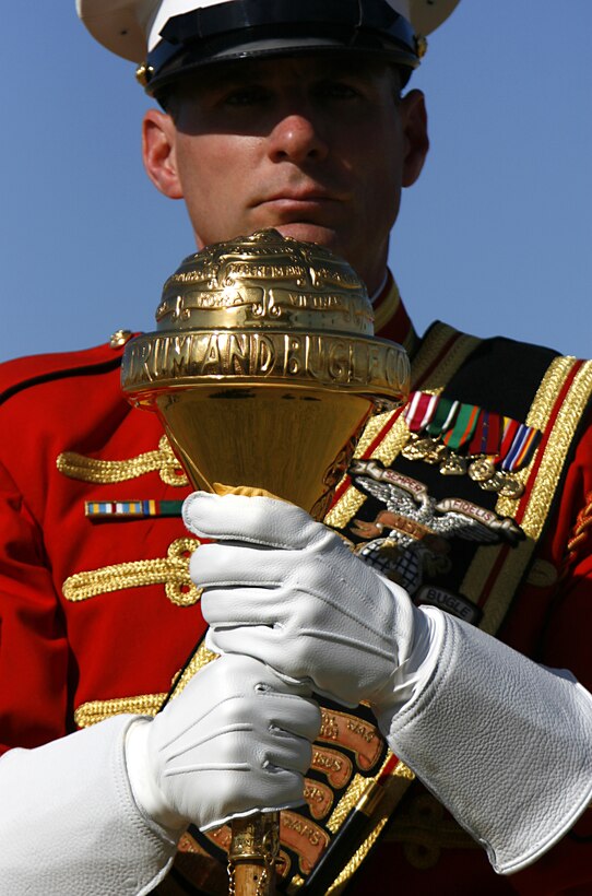 Wearing white leather gauntlets, Master Gunnery Sgt. Mark Miller, drum major for the U.S. Marine Corps' Drum and Bugle Corps, holds the ceremonial mace used to signal commands to musicians during a performance Feb. 24, 2009, at the Marine Corps Air Station in Yuma, Ariz. The performance marked the beginning of the band's annual tour. For approximately the last 20 years, the Drum and Bugle Corps' has trained annually in Yuma before beginning touring. Miller, the 20th drum major of "The Commandant's Own," is a native of Salisbury, Md.