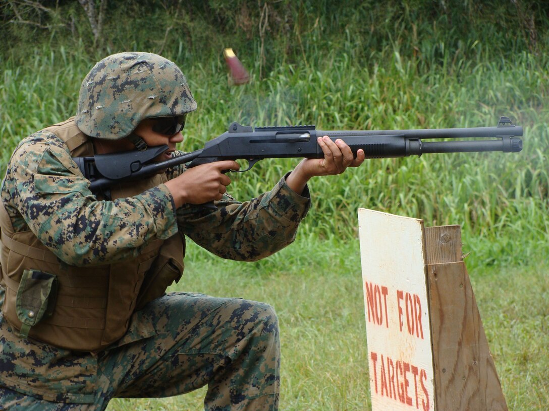 Cpl. Jacob McFarland, commanding general communications team member, shoots off a round from an M1014 shotgun during training Feb. 25. MarForPac Marines spent a day at the infantry demolition range getting familiarized with the shotgun and throwing M67 hand grenades.