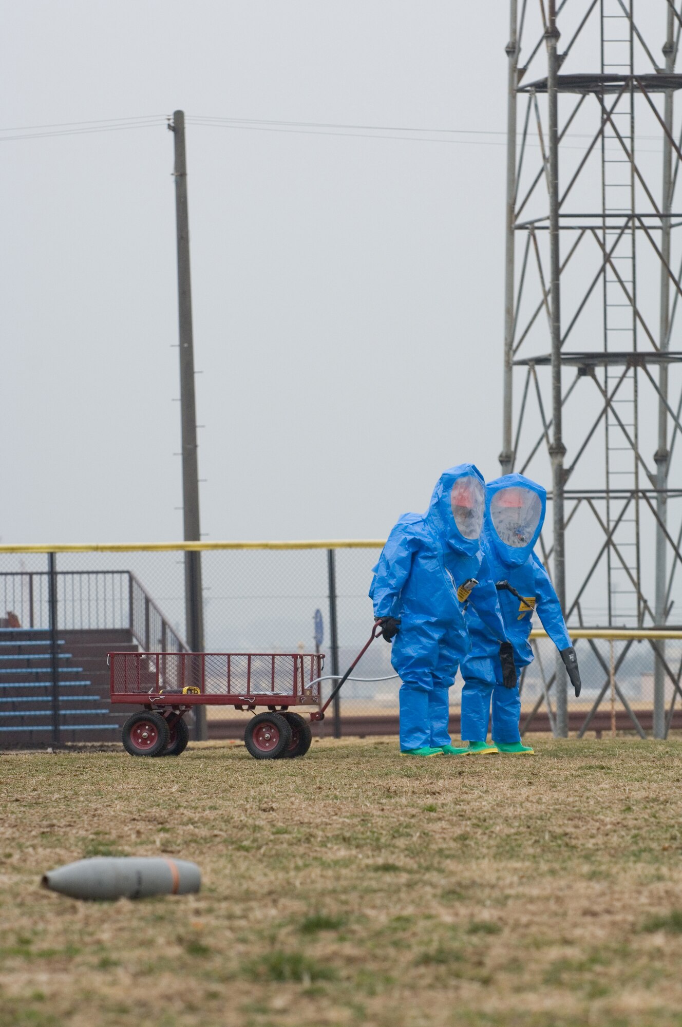 YOKOTA AIR BASE, Japan -- Airman Basic Joshua Chavez, 374th Aerospace Medicine Squadron, and Airman 1st Class Sean Gold, 374th Civil Engineer Squadron, investigate a simulated contaminated area during a chemical response exercise here Feb. 24. The exercise was part of All Hazards Response Training to prepare 374th Airlift Wing Airmen to respond appropriately to a chemical incident. (U.S. Air Force photo/Osakabe Yasuo)

