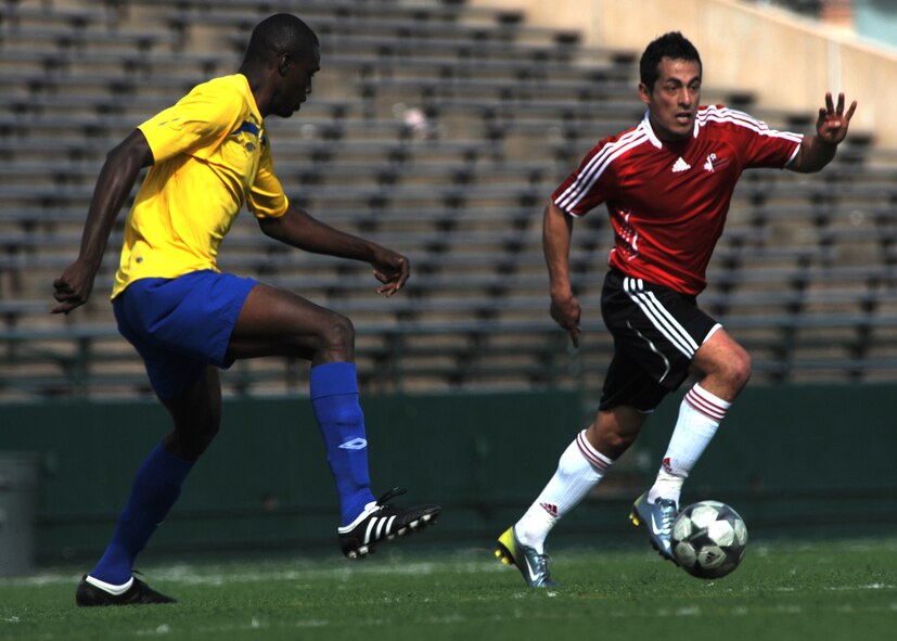 ABILENE, Texas - Barbados (yellow) competes in the fourth day of the CISM tournament against Canada at Shotwell Stadium here, Feb. 25. Barbados won 8-0. Also in action Brazil defeated Suriname 6-0. (U.S. Air Force photo by Airman 1st Class Stephen Reyes) 