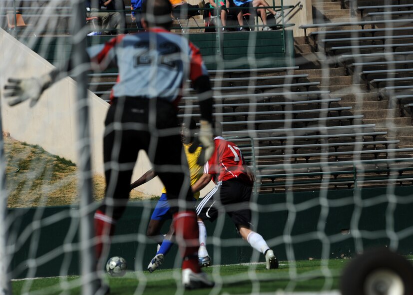 ABILENE, Texas - Barbados (yellow) competes in the fourth day of the CISM tournament against Canada at Shotwell Stadium here, Feb. 25. Barbados won 8-0. Also in action Brazil defeated Suriname 6-0. (U.S. Air Force photo by Airman 1st Class Stephen Reyes) 