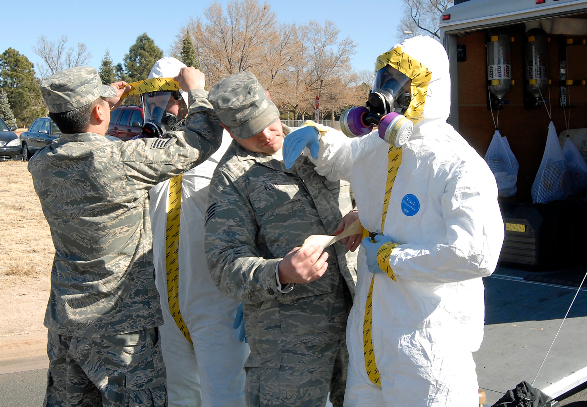 Emergency responders from the 21st Aerospace Medicine Squadron bioenvironmental flight responded to numerous scenarios during Condor Crest Feb. 9 to 12. Here, the responders don respirators and protective suits, designed to shield them against airborne contaminants. The exercise is designed to test how the wing responds to emergent situations in order to sharpen installation protection and hone warrior skills. (U.S. Air Force photo by Roberta McDonald)