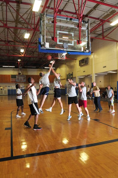 Instructors from the Senior NCO Academy at Maxwell Air Force Base's Gunter Annex play a game of basketball against Chief Master Sgt. of the Air Force Rodney J. McKinley and other chief master sergeants Wednesday. Chief McKinley's team defeated the SNCOA instructors in the early-morning game. (Air Force photo by Master Sgt. Scott Moorman)