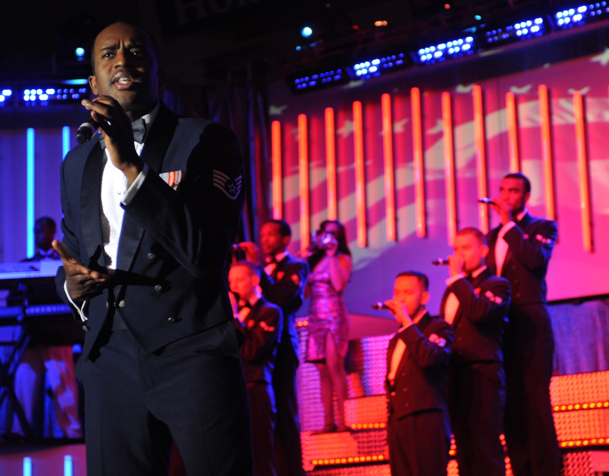 090223-F-4314C-136
CANNON AIR FORCE BASE, N.M. -- Staff Sgt. Corey Sims, of the 944th Communications Flight at Luke Air Force Base, Ariz., sings during the Tops in Blue 2008 "Deja Blue" World Tour performance at Greyhound Arena, in Portales, N.M., Feb. 23. This was the group's first performance in eight years at Portales. (U.S. Air Force photo/Airman 1st Class Evelyn Chavez)
